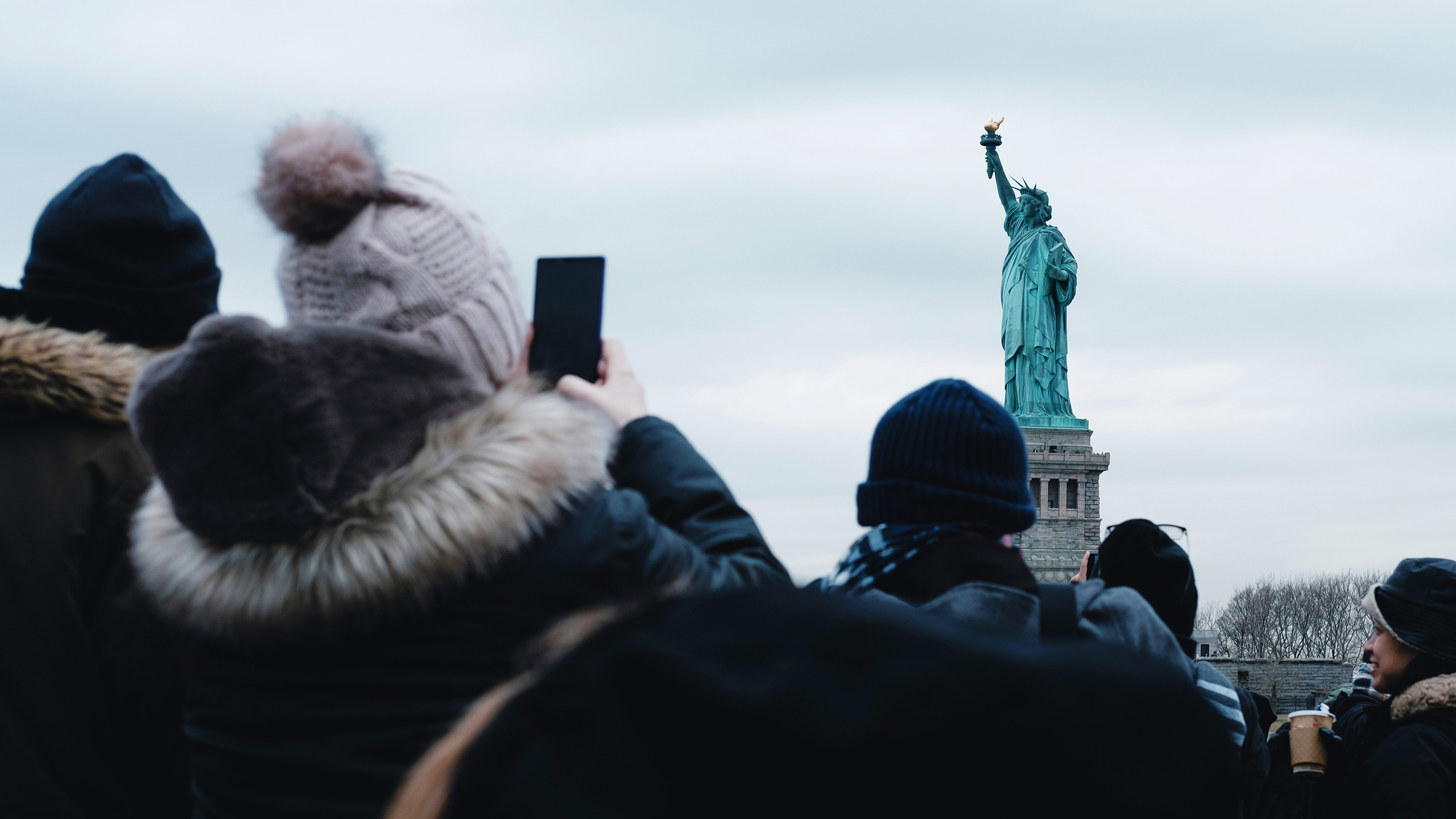 Photo of people visiting the Statue of Liberty