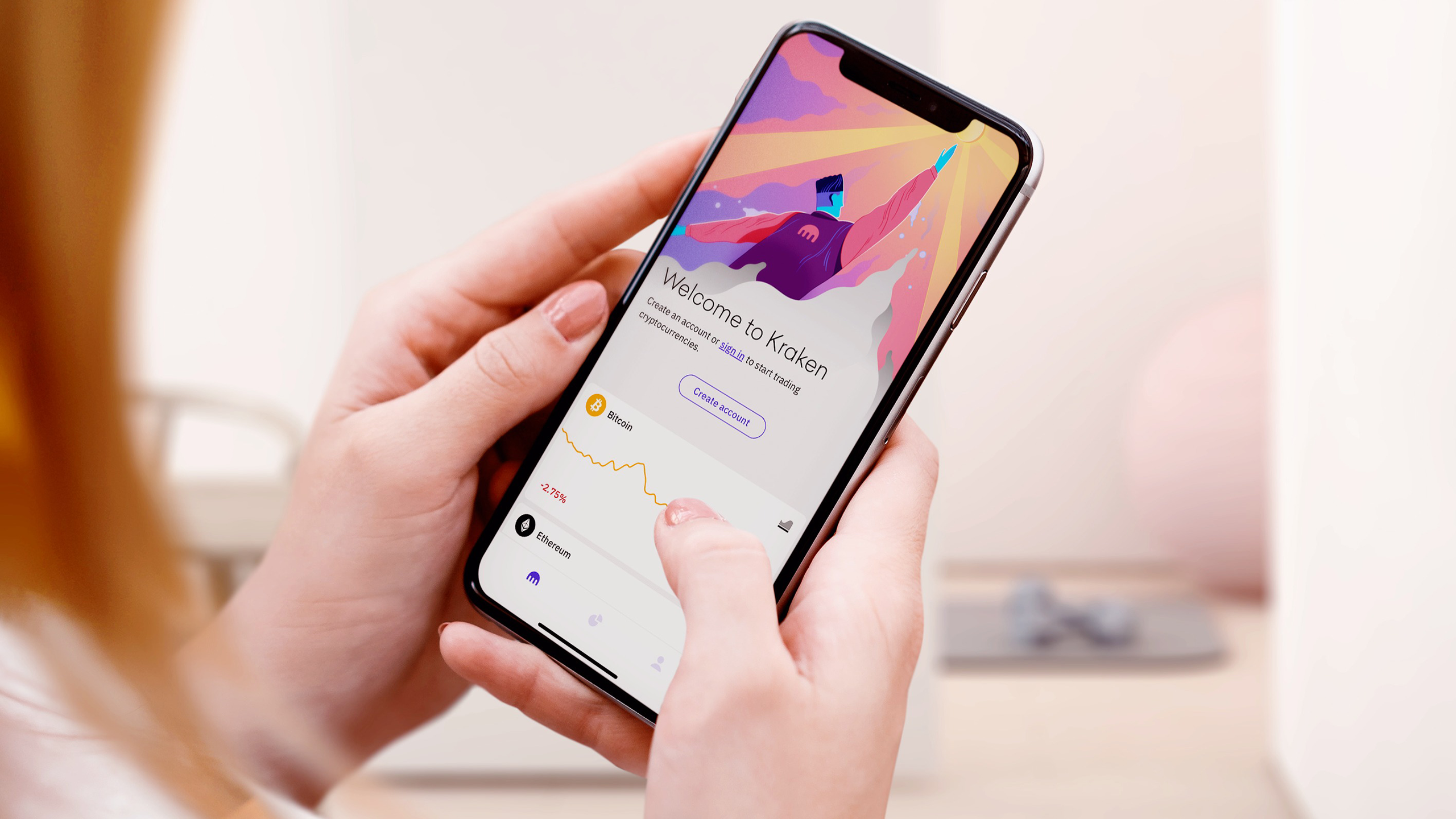 Photo of a person using the Kraken app