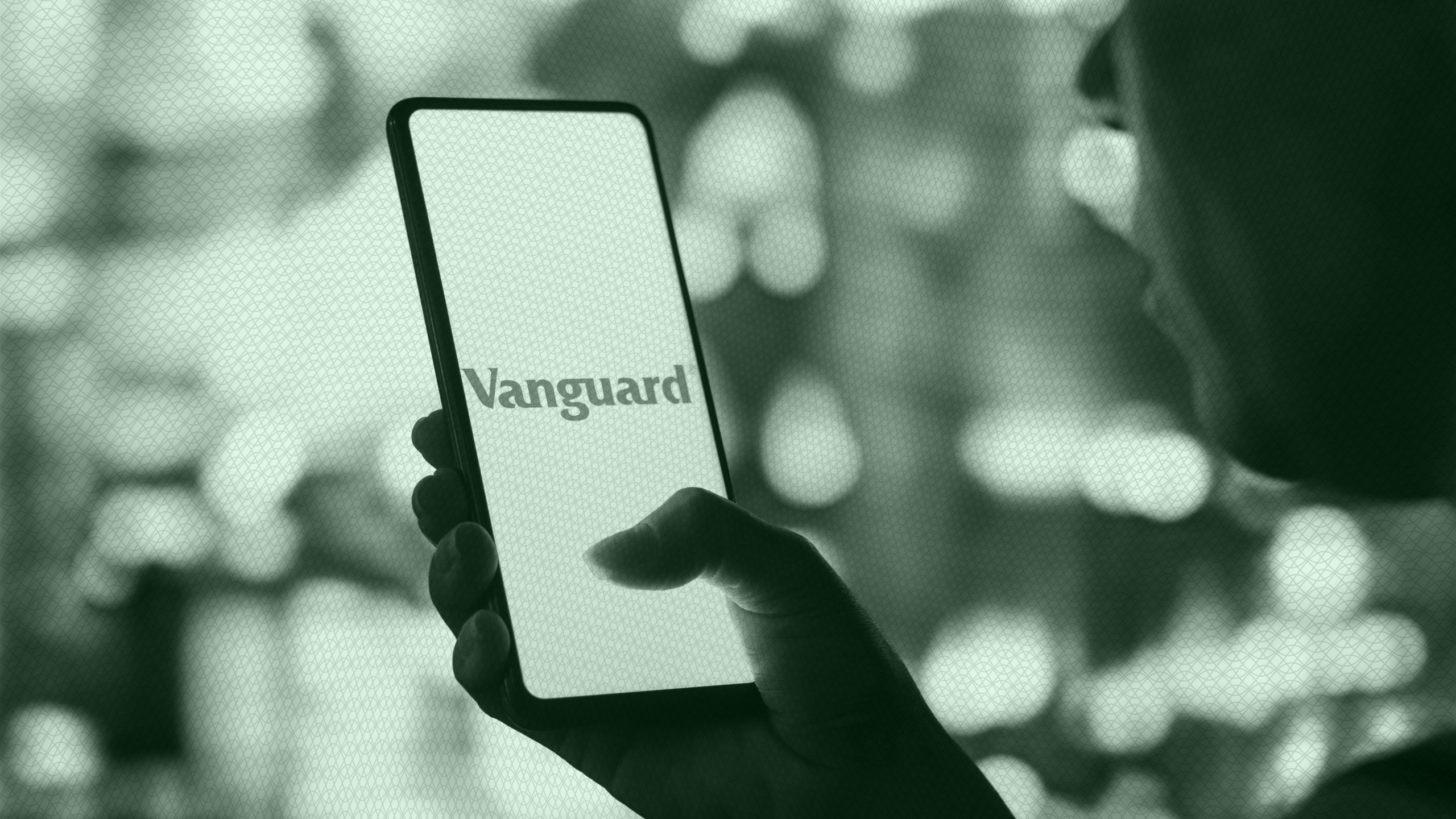 Photo of a Vanguard logo on a phone