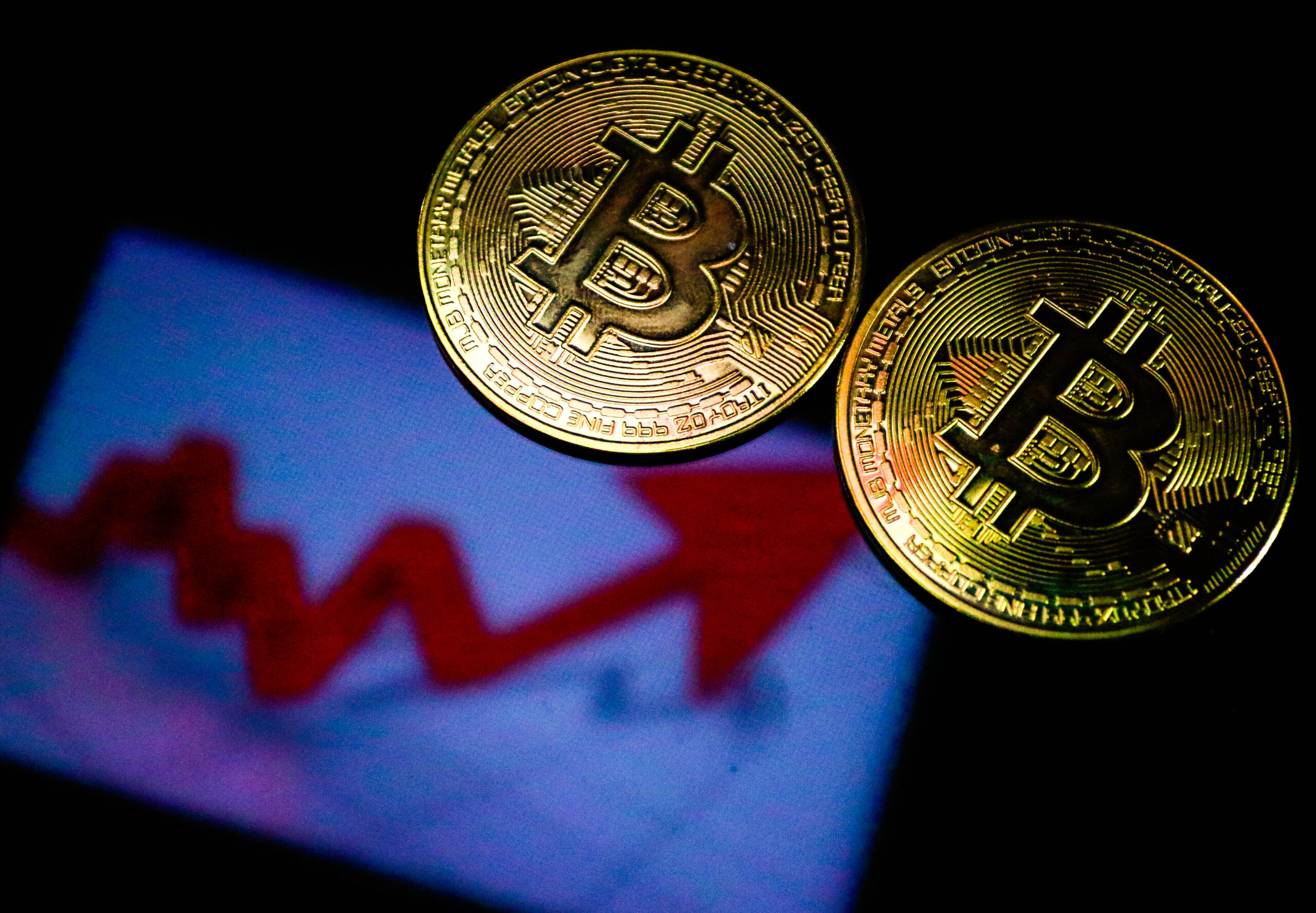 Photo of two bitcoin.