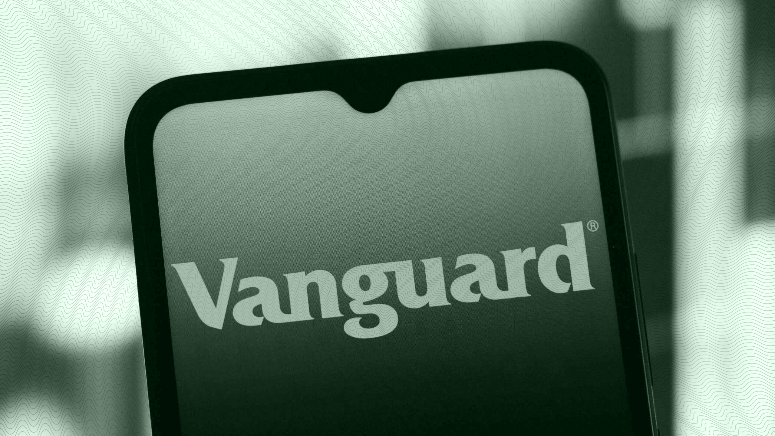 The Vanguard logo on a phone.