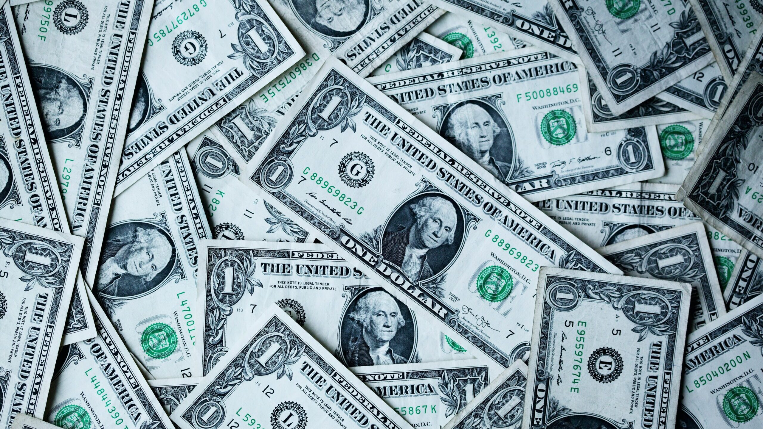 Photo of a pile of one dollar bills