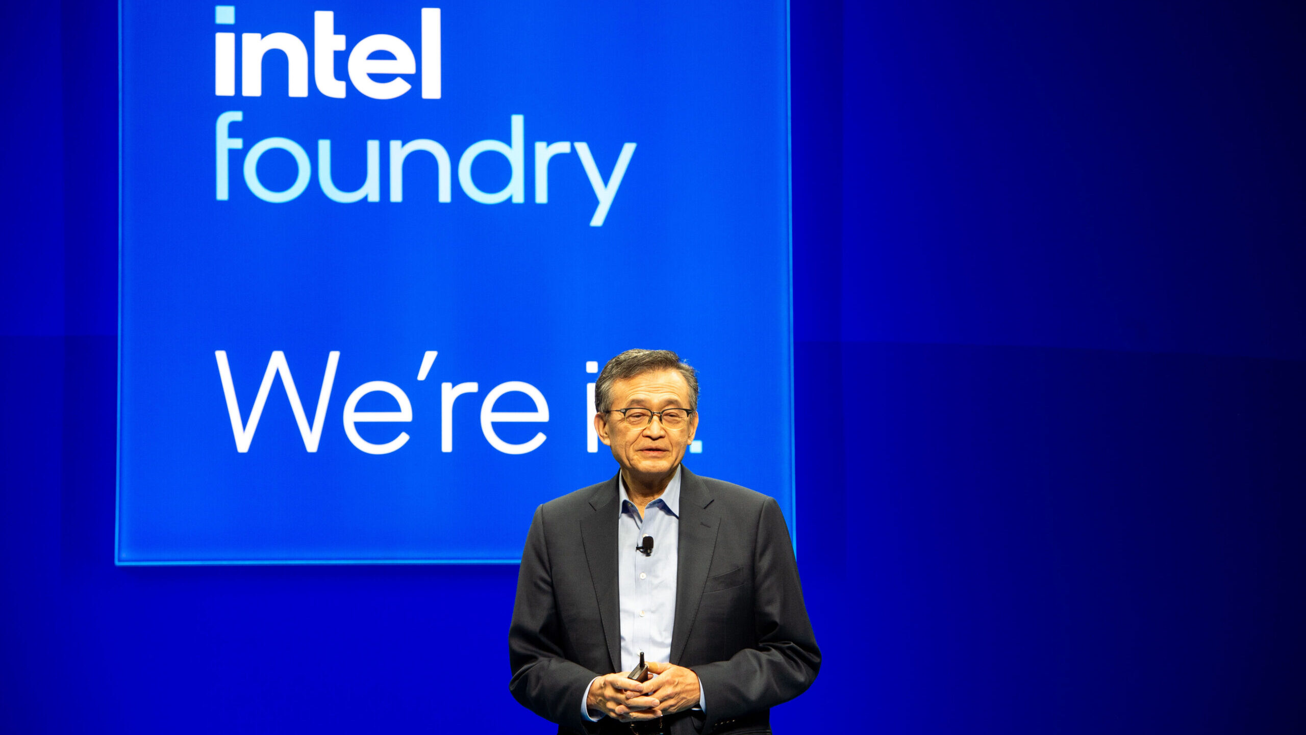Lip-Bu Tan, Chief Executive Officer of Intel, appears at an event organized by the company in front of a background with its logo.