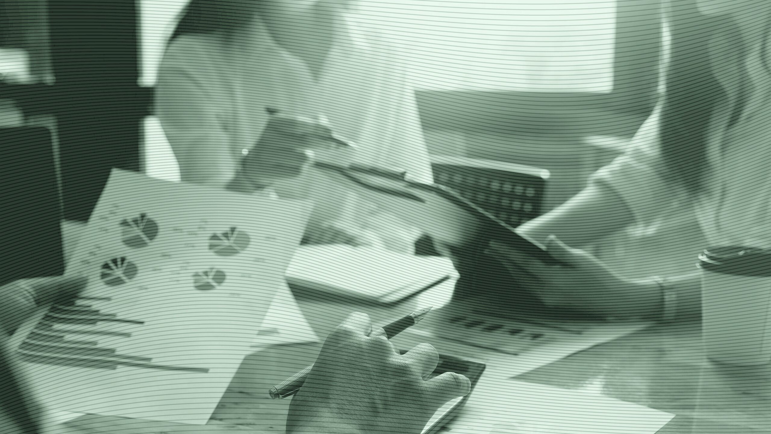 People at a desk doing financial planning.