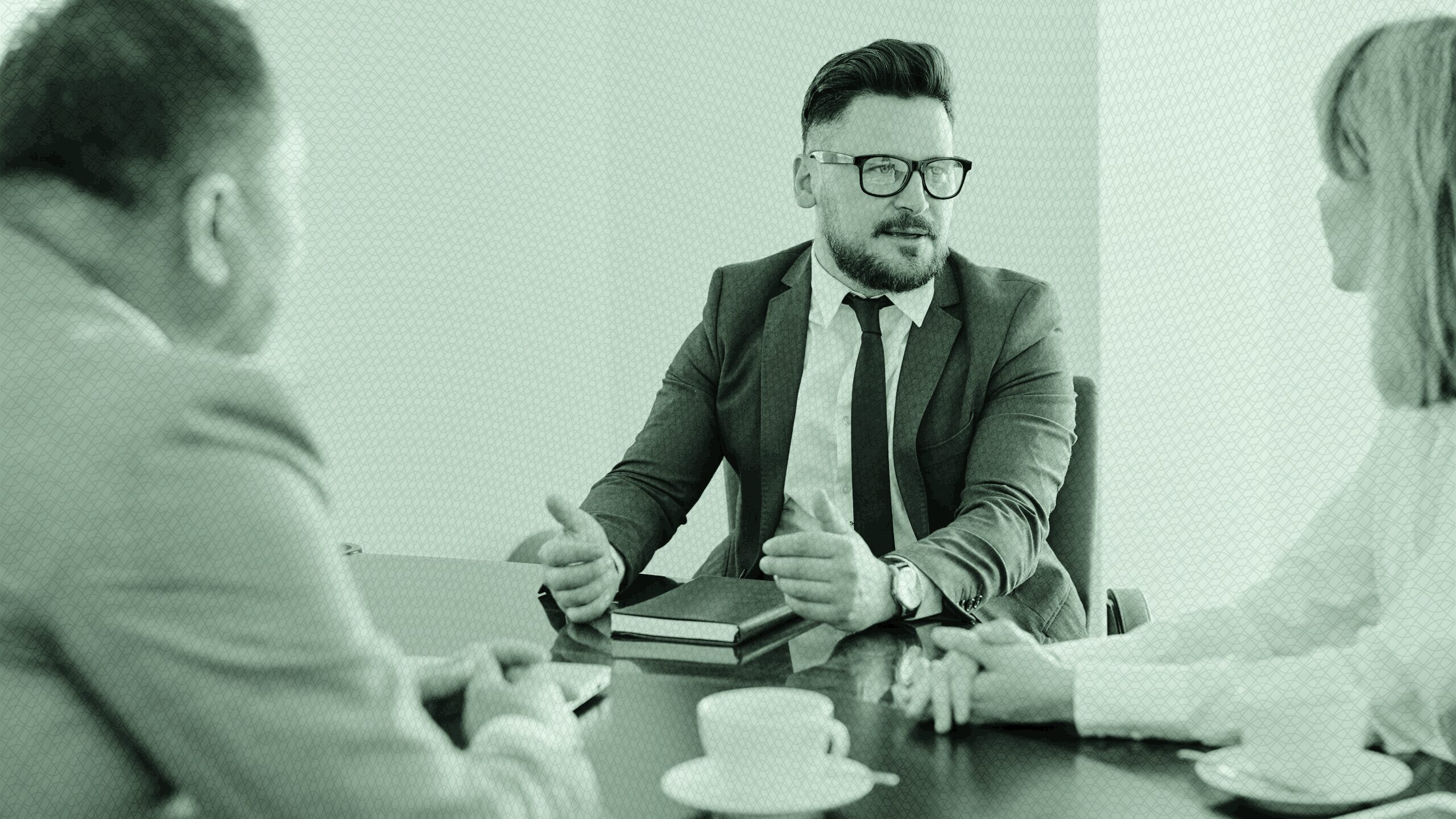Three people in a client meeting.