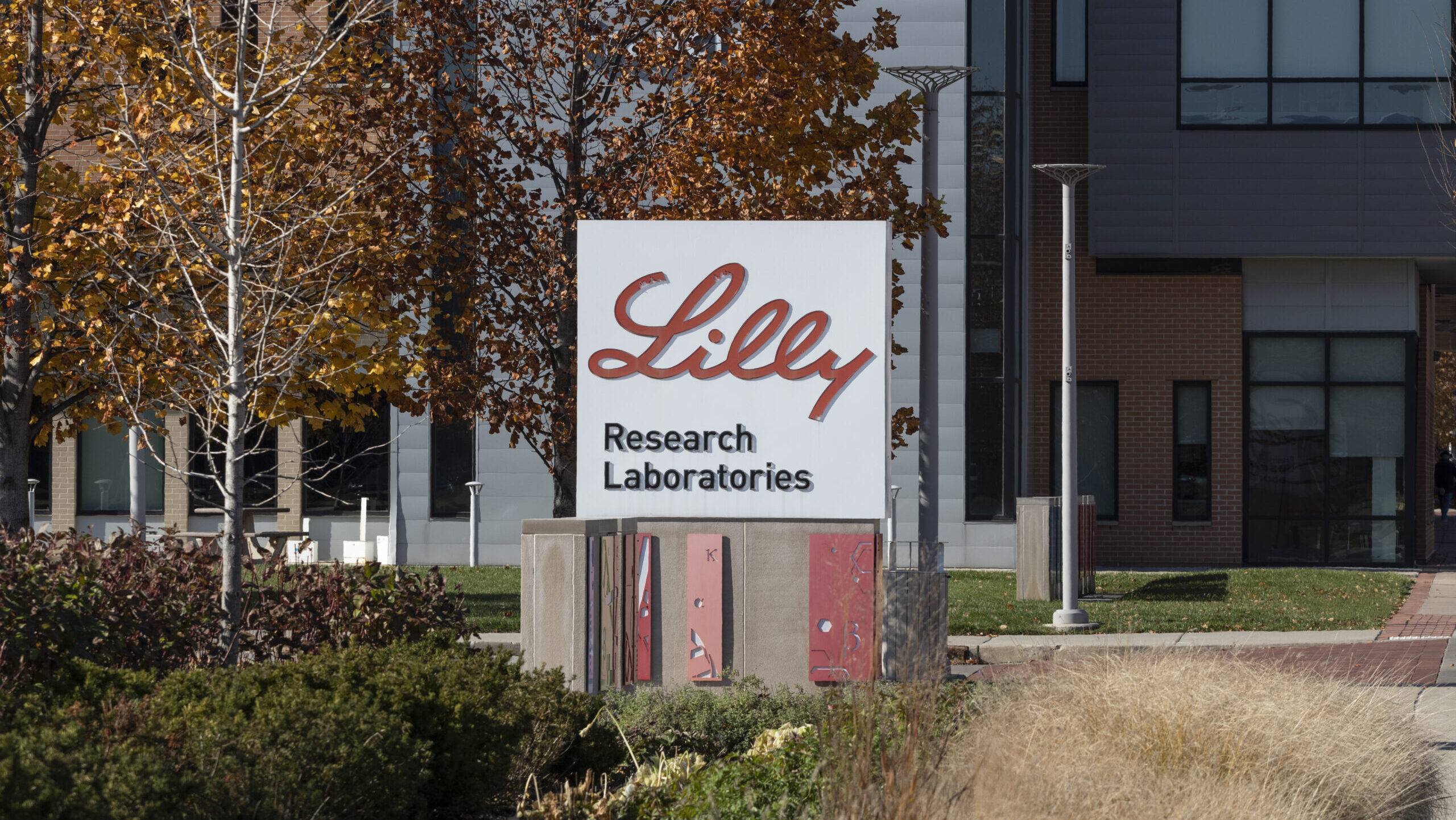A sign for research laboratories is shown in front of a building at Eli Lilly's world headquarters.