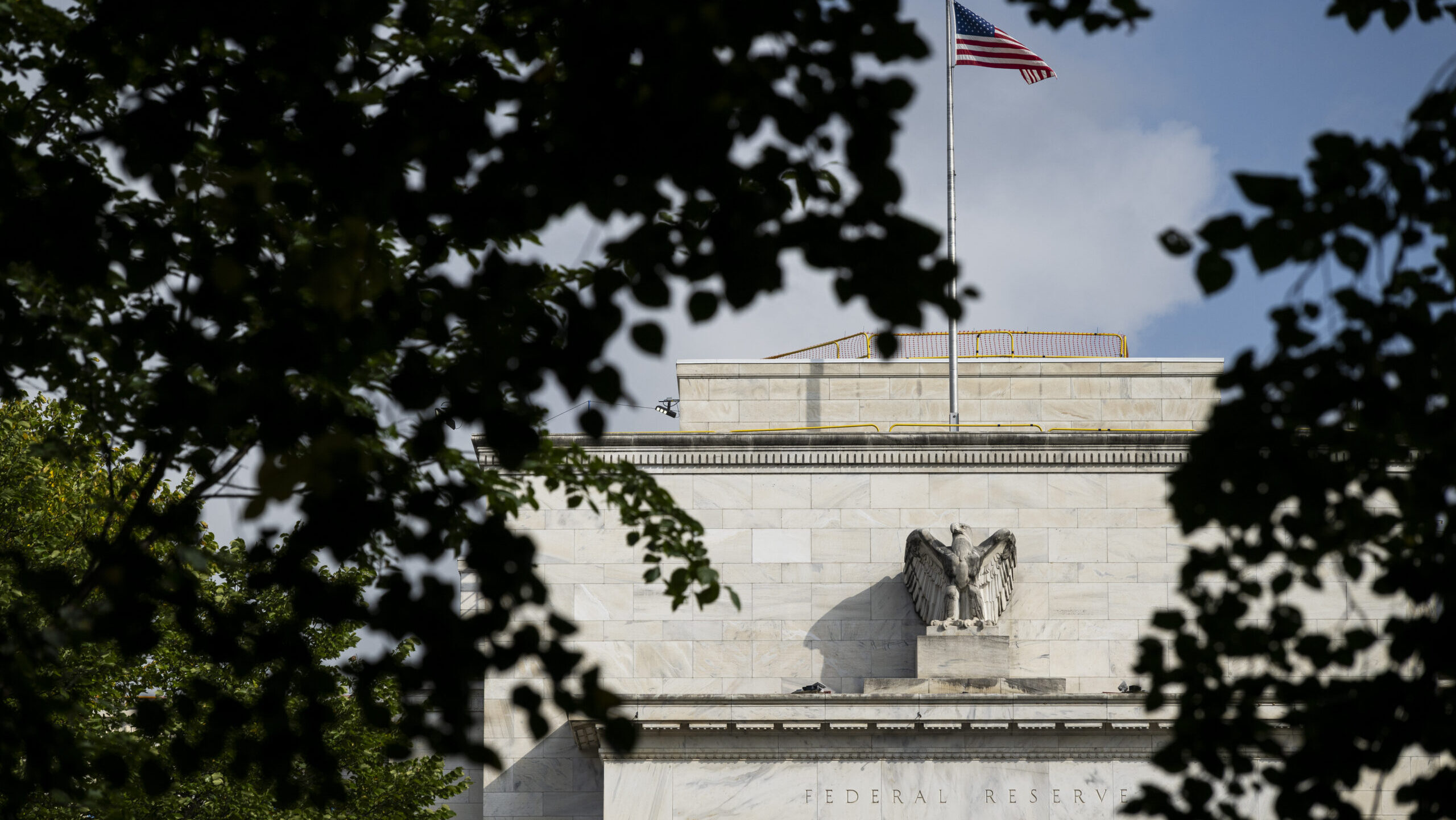 The US flag flies above the Federal Reserve's Eccles Building in Washington, D.C.