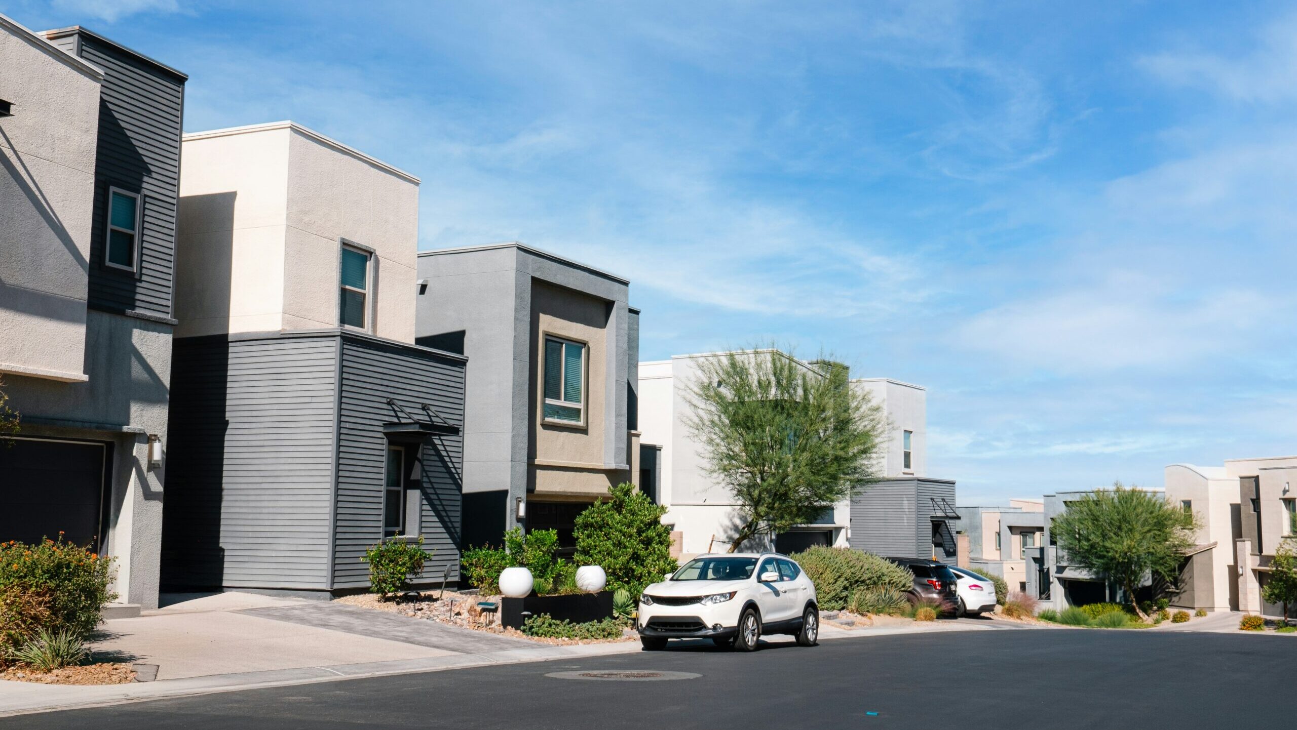 A row of houses are shown along a street in suburban Henderson, Nevada.