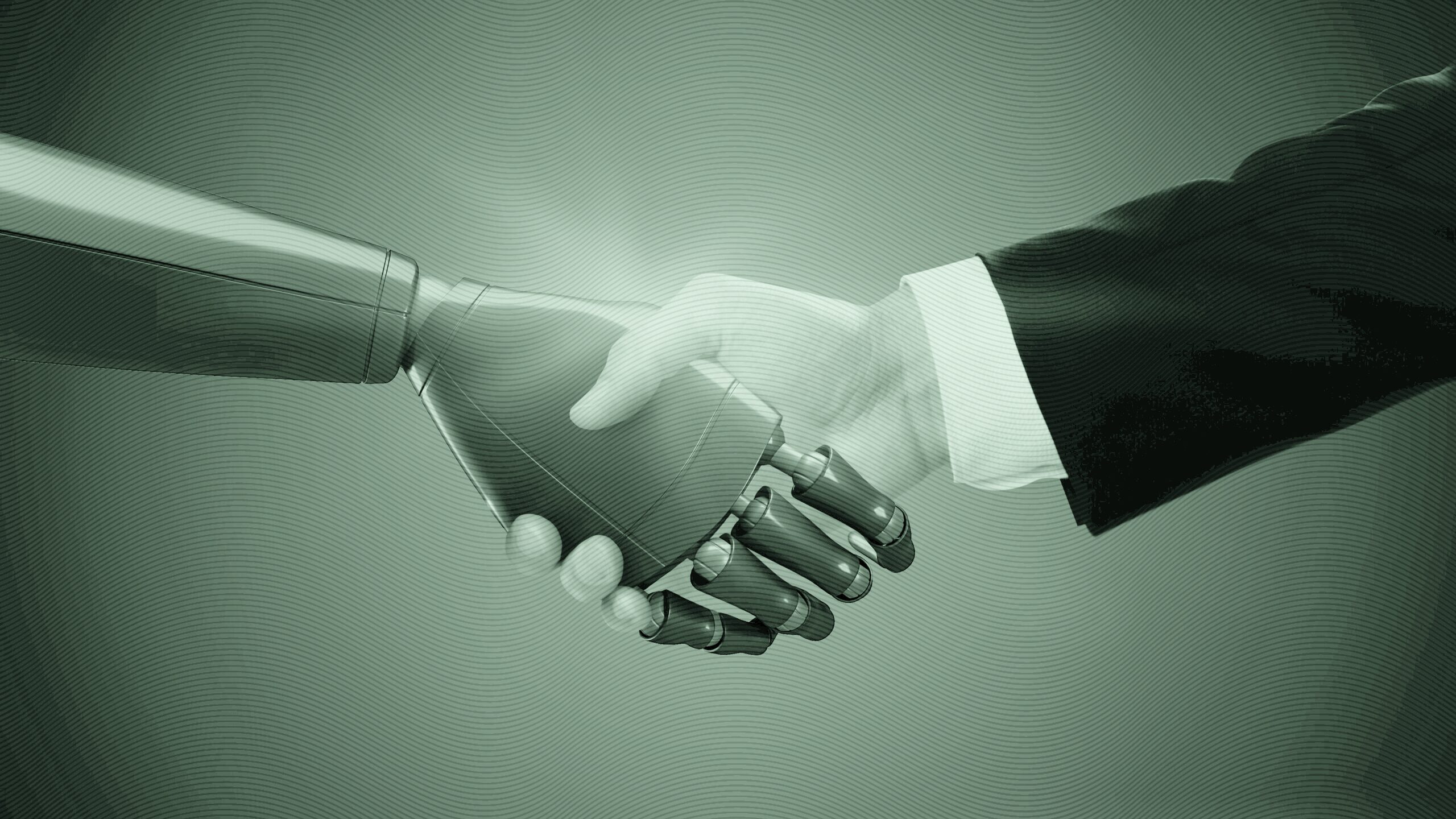 A robot and human shaking hands.