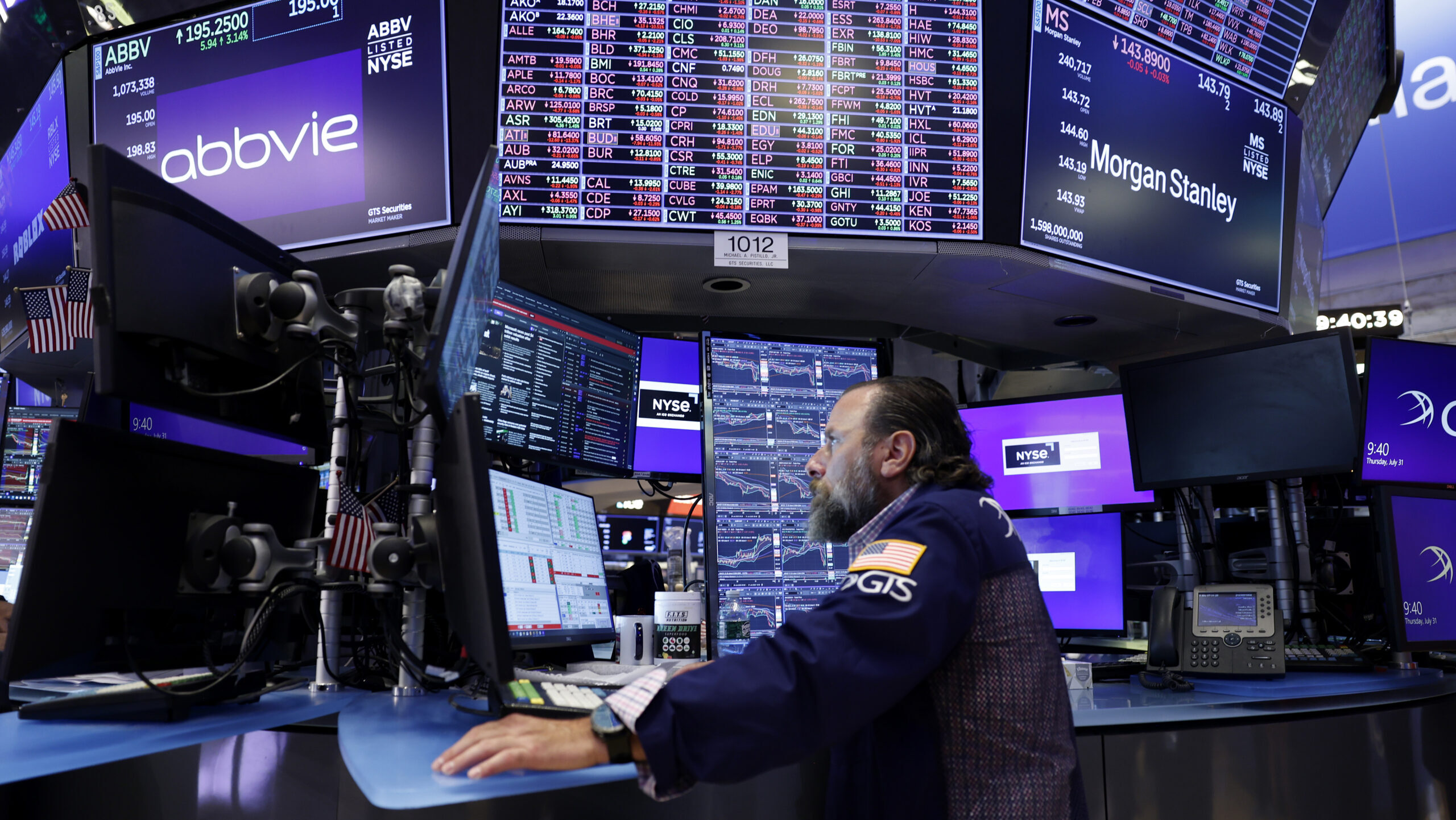 Traders work on the floor of the New York Stock Exchange on Wall Street on Thursday, July 31, 2025 in New York City.