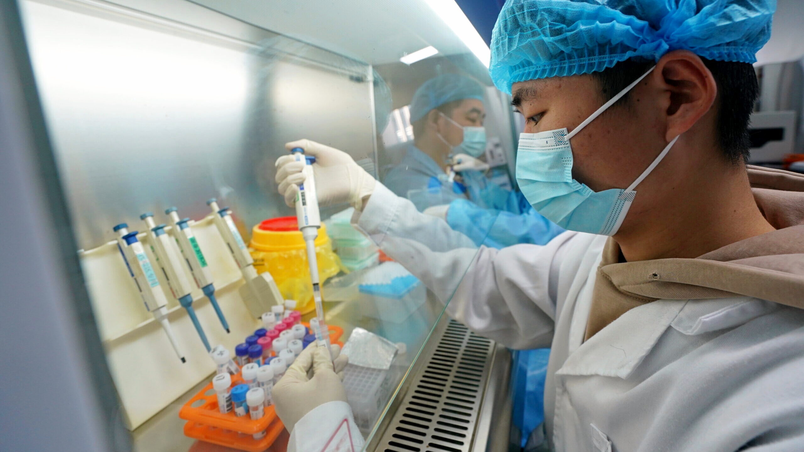 Research staff members are shown working in a biotech lab at the Zhongguancun Science Park in China's Hebei Province.