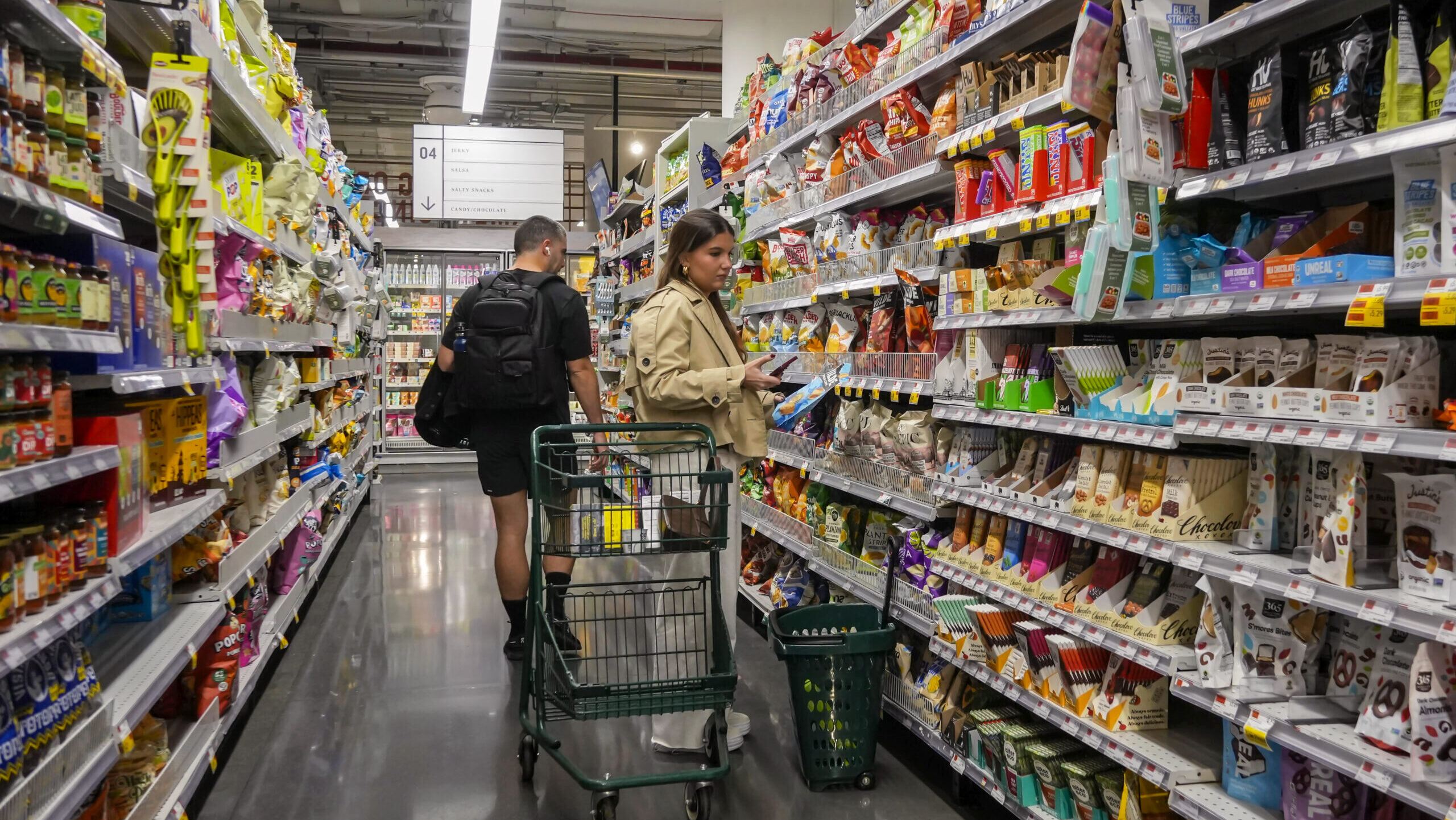 Photo of people shopping in a grocery store.