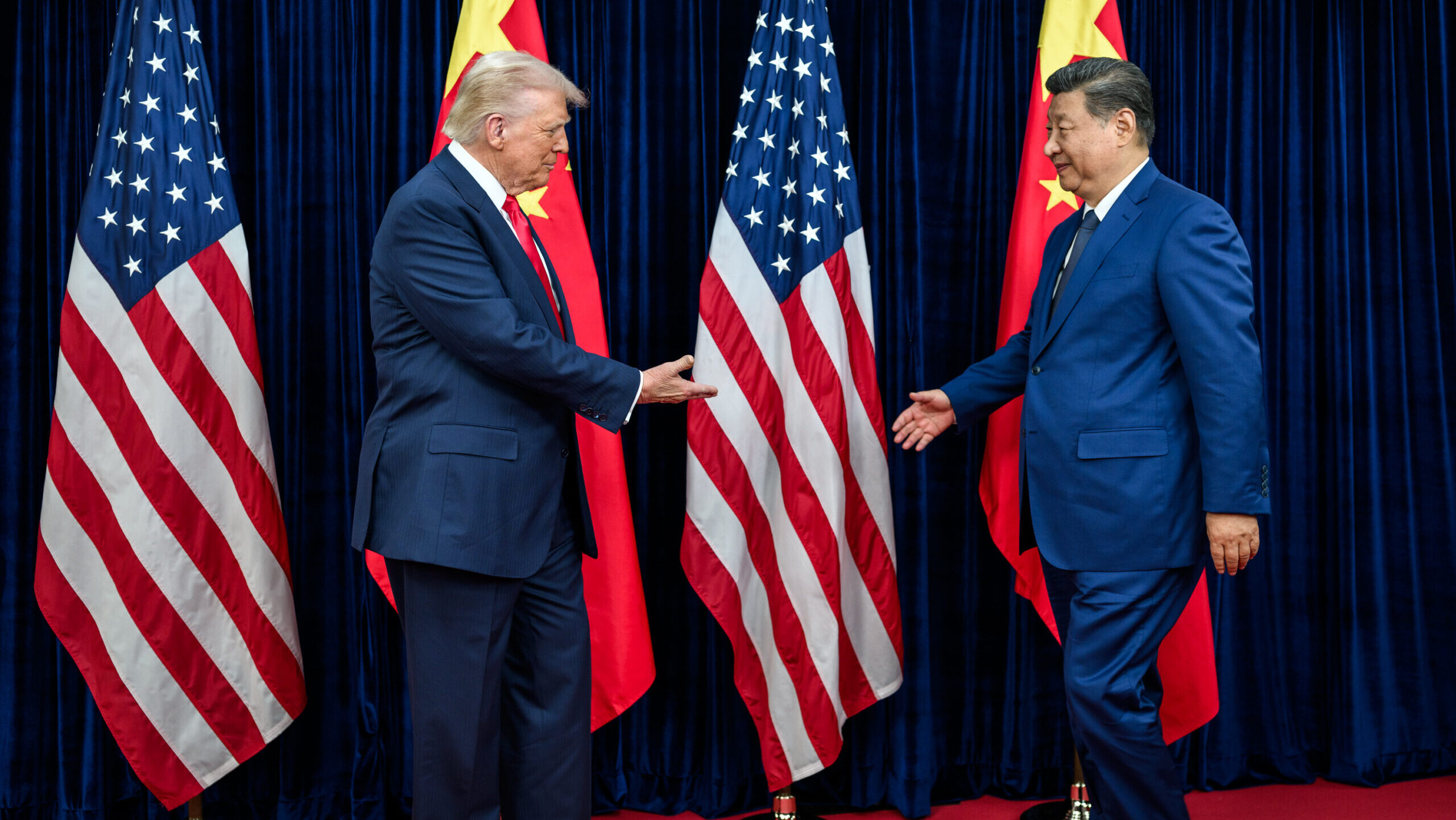President Donald Trump greets Chinese President Xi Jinping before a bilateral meeting at the Gimhae International Airport terminal in South Korea on October 30, 2025.