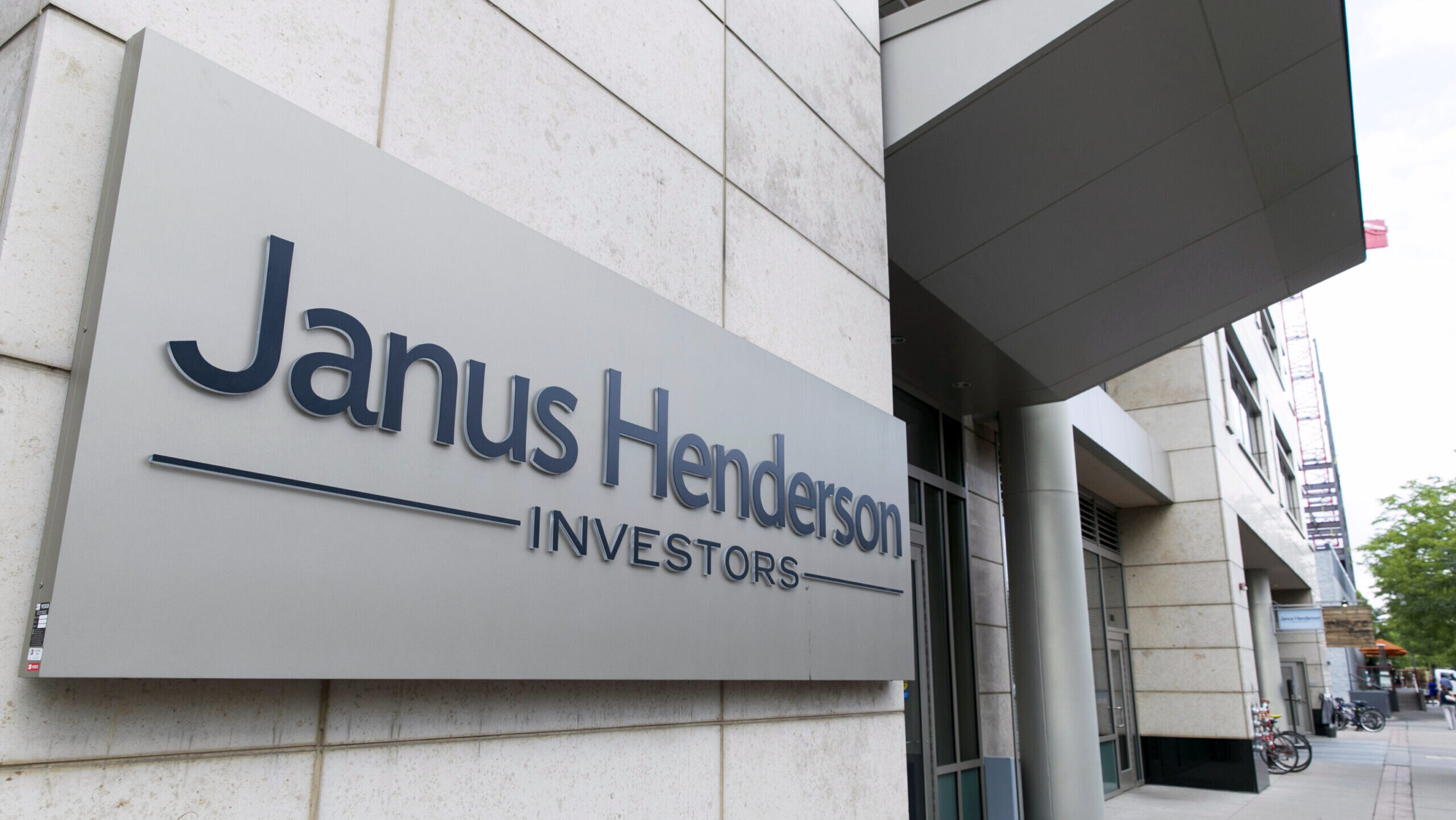 Photo of a Janus Henderson logo outside an office building.