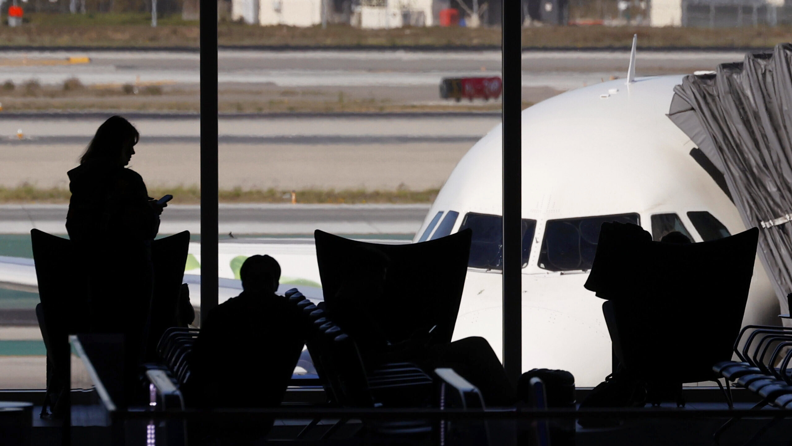 Image of travelers in an airport.