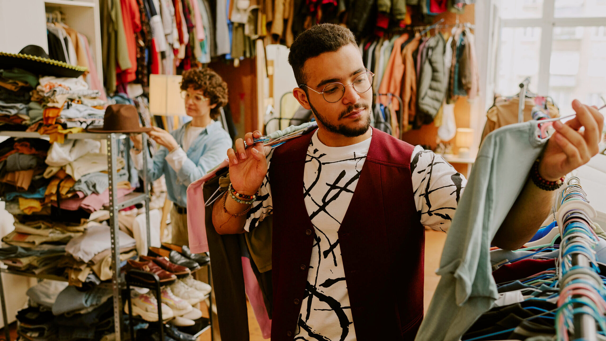 Photo of a man shopping for clothes.