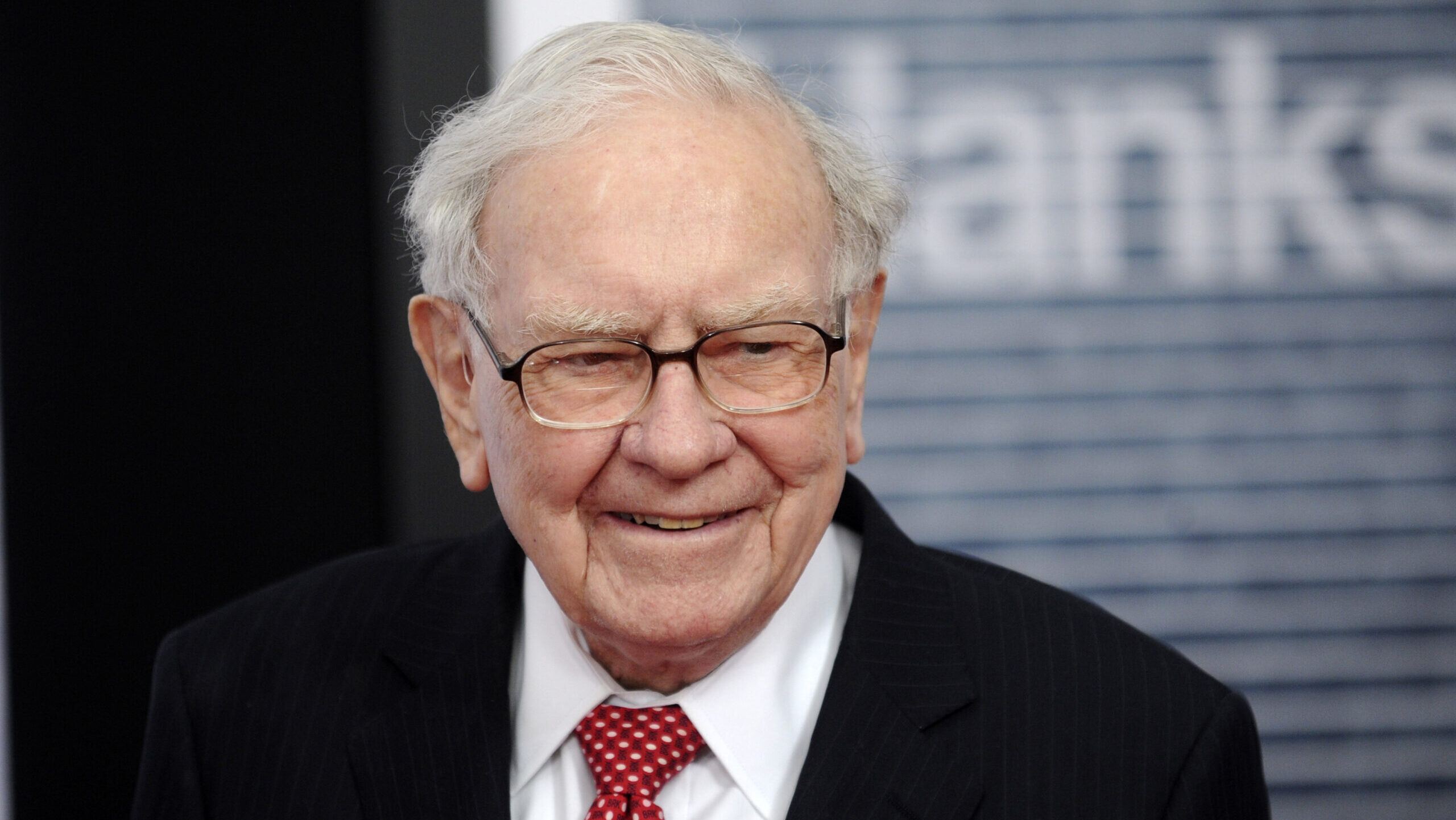 Warren Buffett is shown smiling outside of the former Newseum in Washington, D.C.
