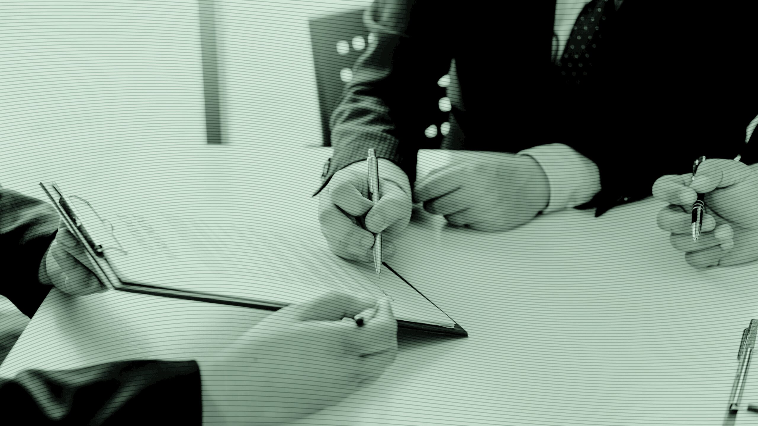 People signing a deal.