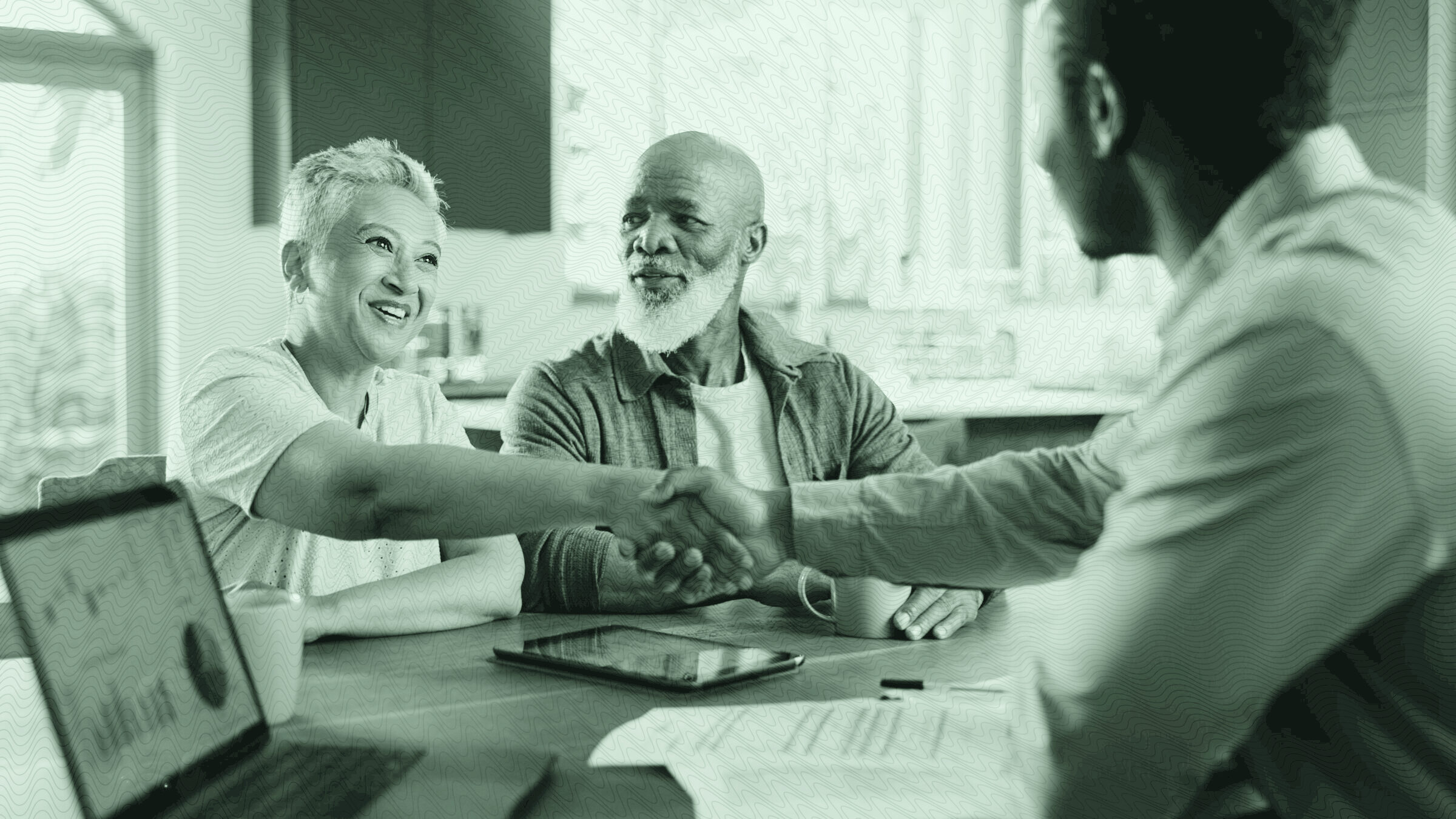 A couple talking to their financial planner.