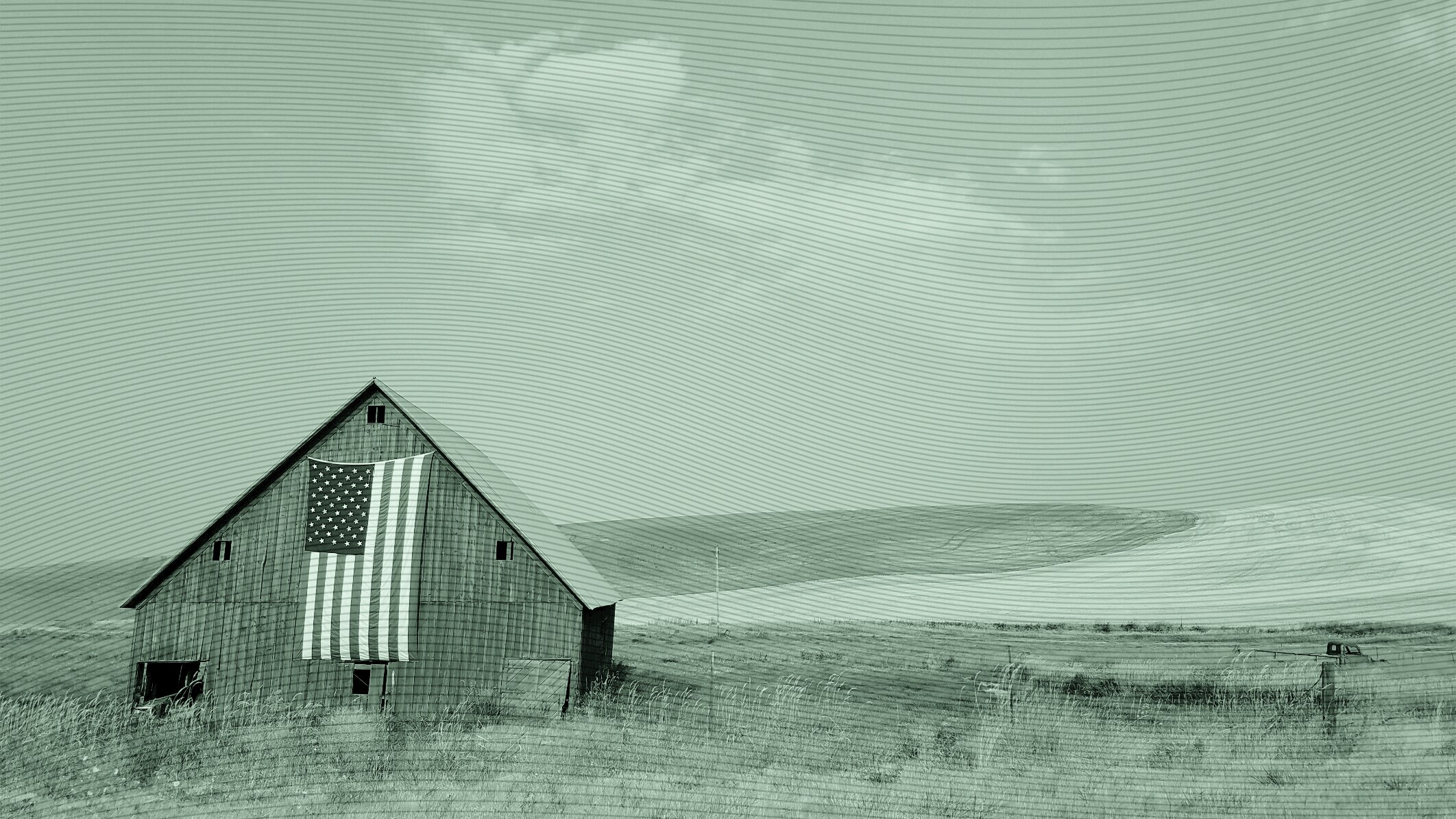 a barn with an American flag.