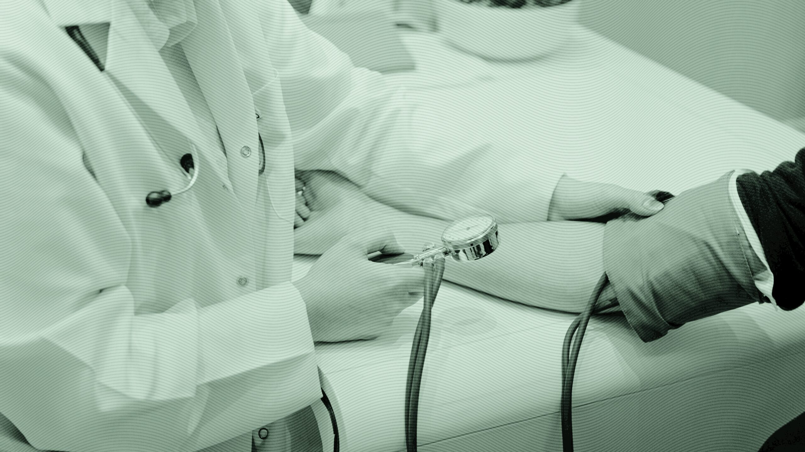 A doctor checking a patient's blood pressure