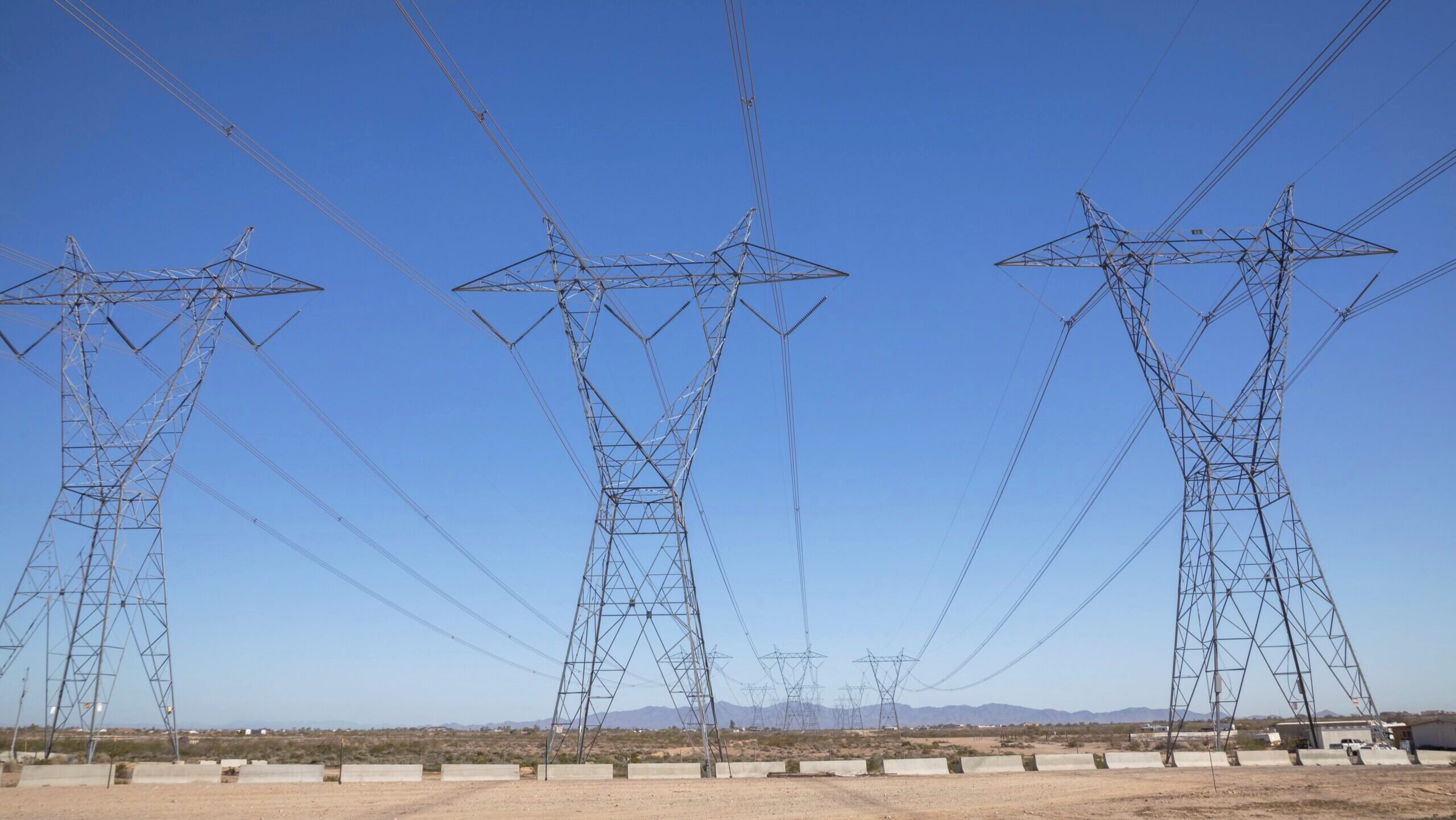 Photo of power lines in the desert.