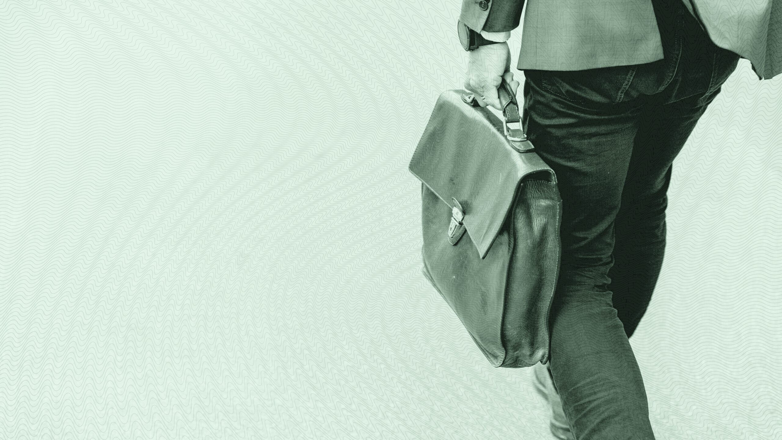 A man walking with a briefcase.