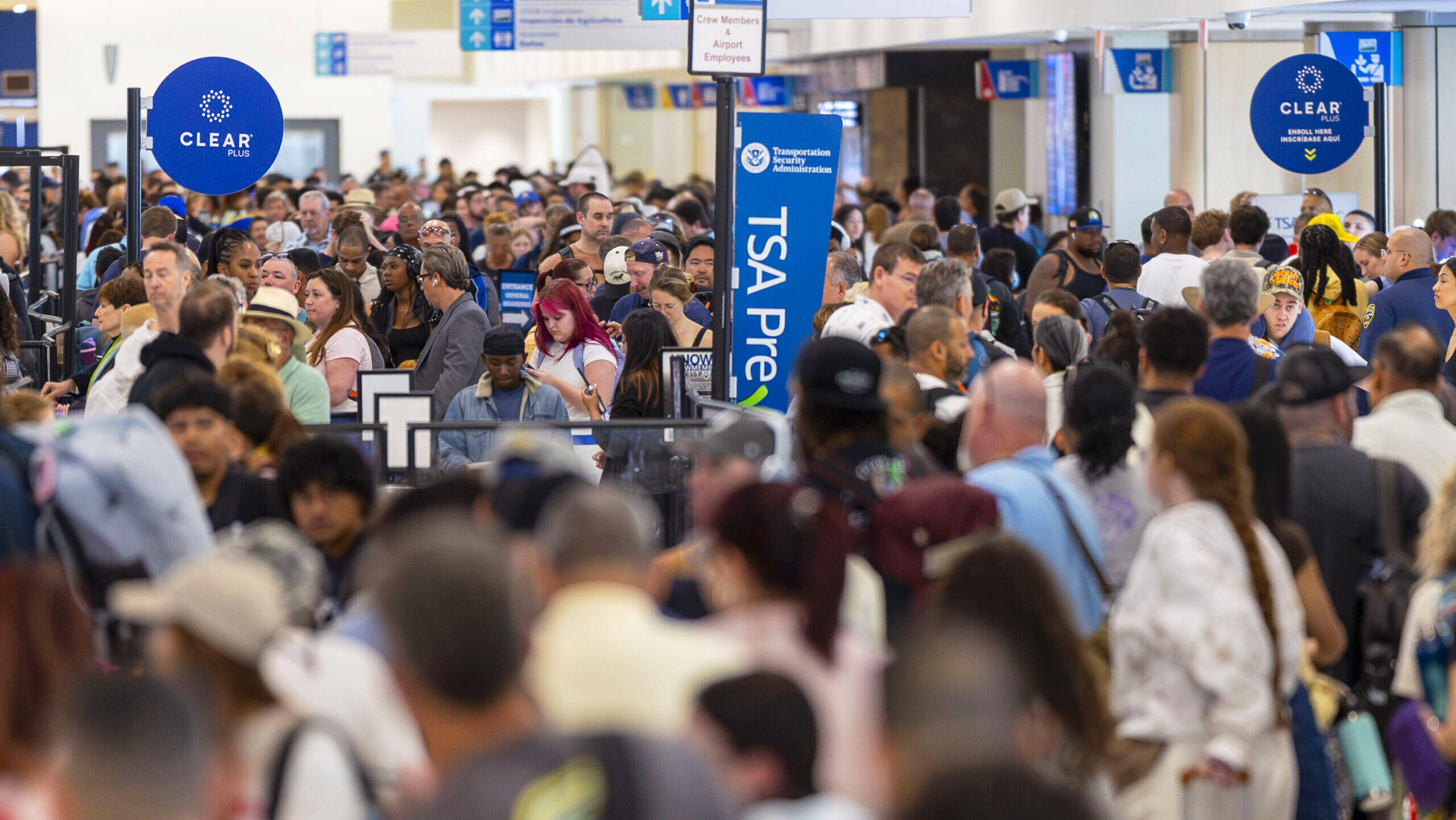 Photo of a crowd in TSA lines at an airport.