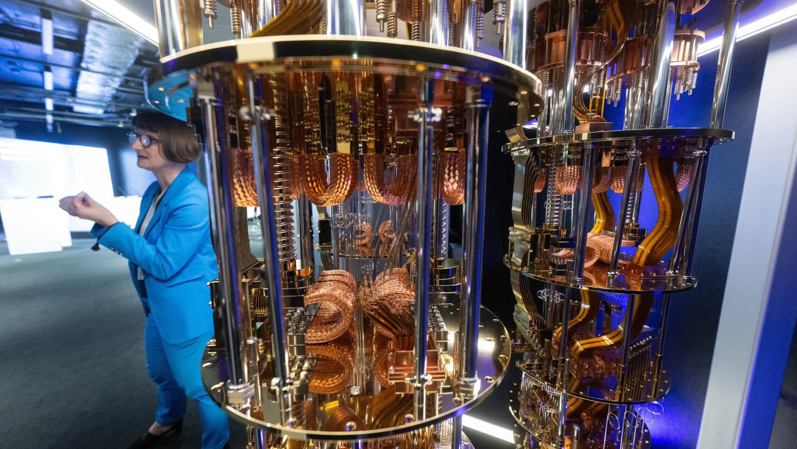 Heike Riel, physicist and IBM Fellow, stands next to a model of a suspension of a quantum chip.