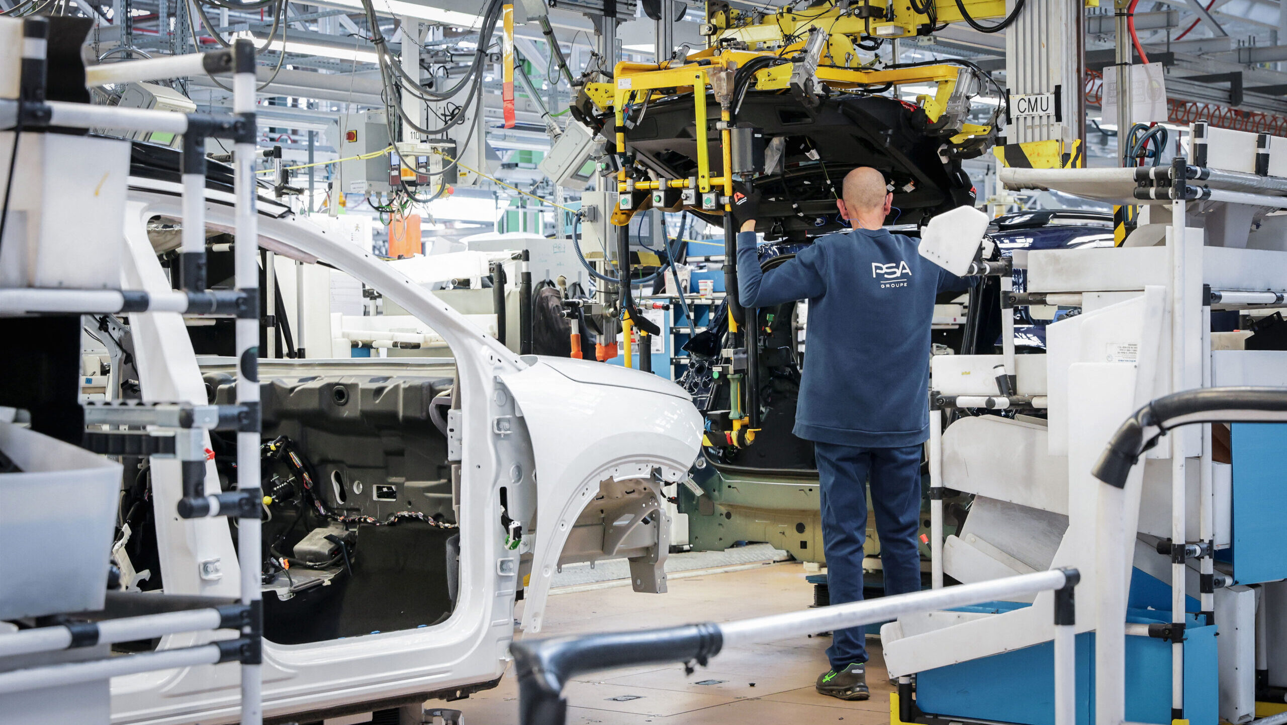 A worker assembles Citroën vehicles at a Stellantis factory in France.