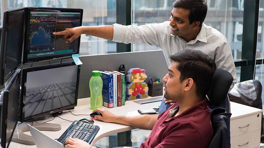 Staff at Guragon's Graviton Research Capital, a high speed trading unicorn based in the satellite city of Delhi, work in an office.