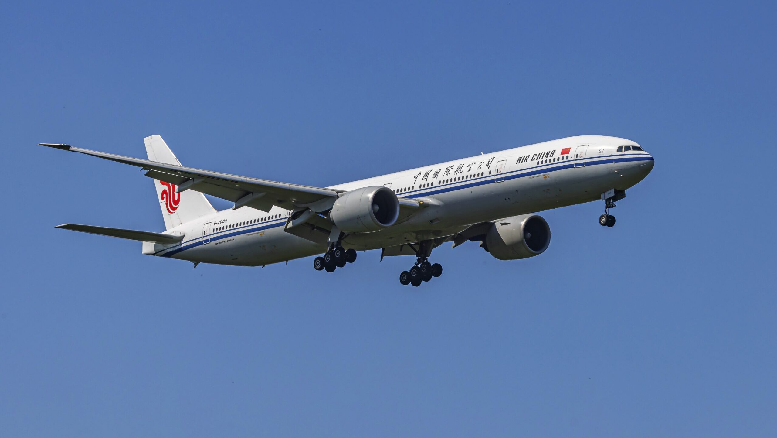 An Air China Boeing 777 aircraft approaches Frankfurt airport in preparation for landing.