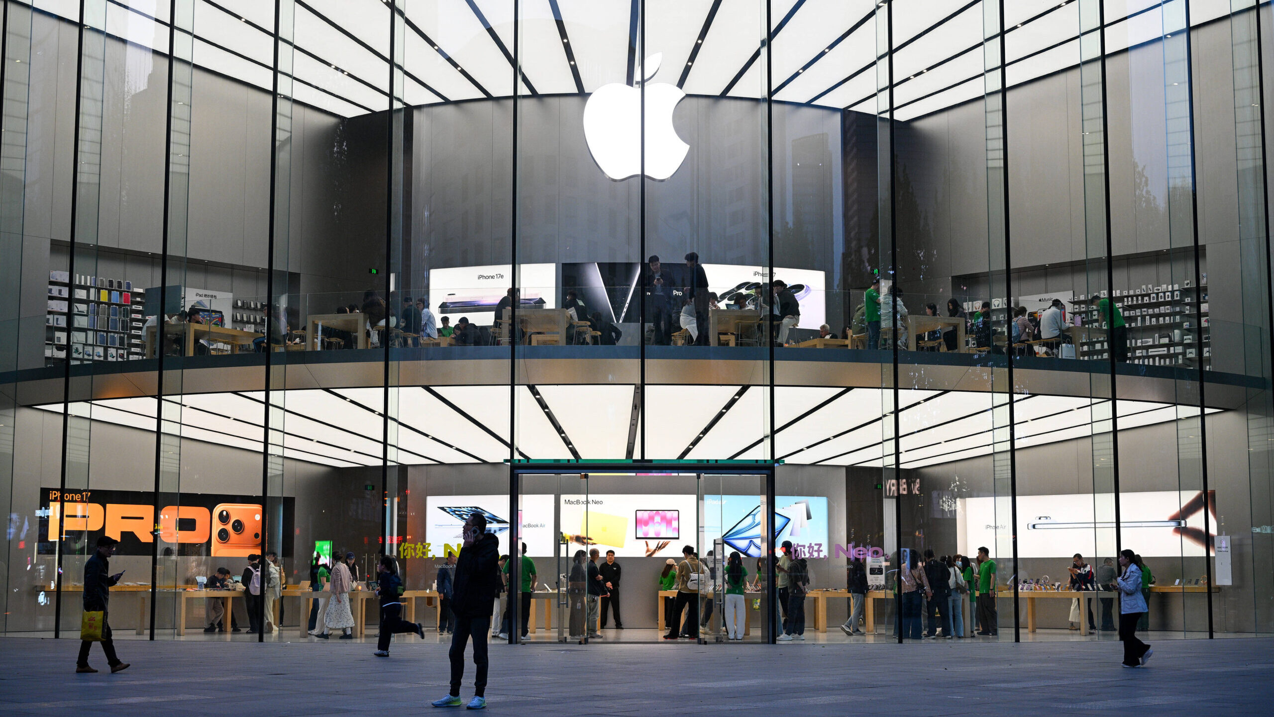 Customers are shown at an Apple store in Nanjing, China.
