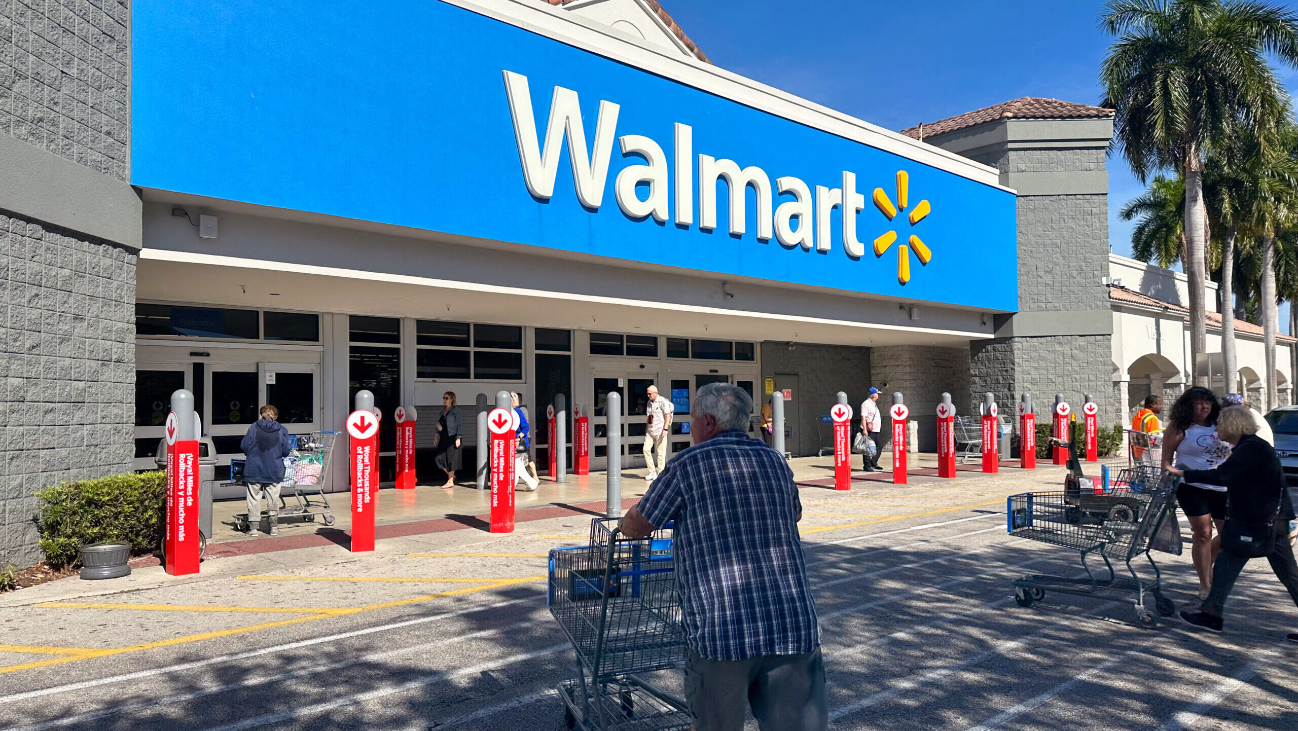 Photo of shoppers entering a Walmart.