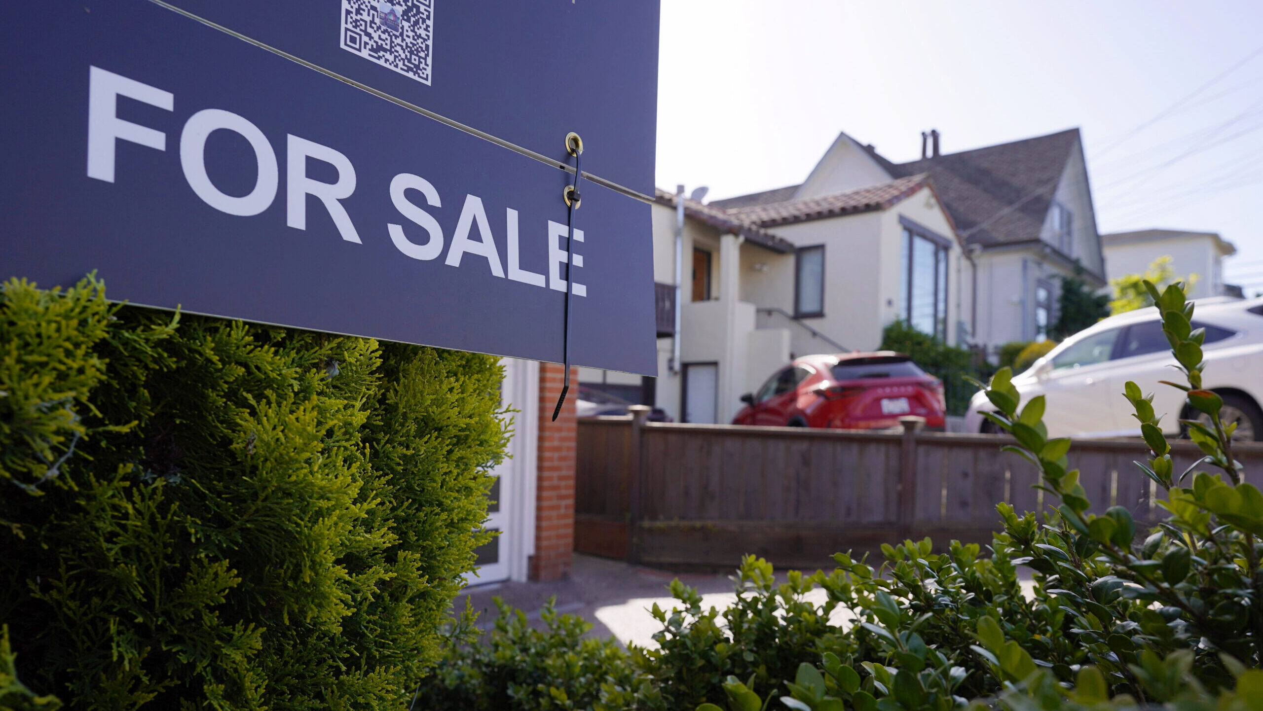 Photo of a "For Sale" sign outside a home in San Mateo, California.