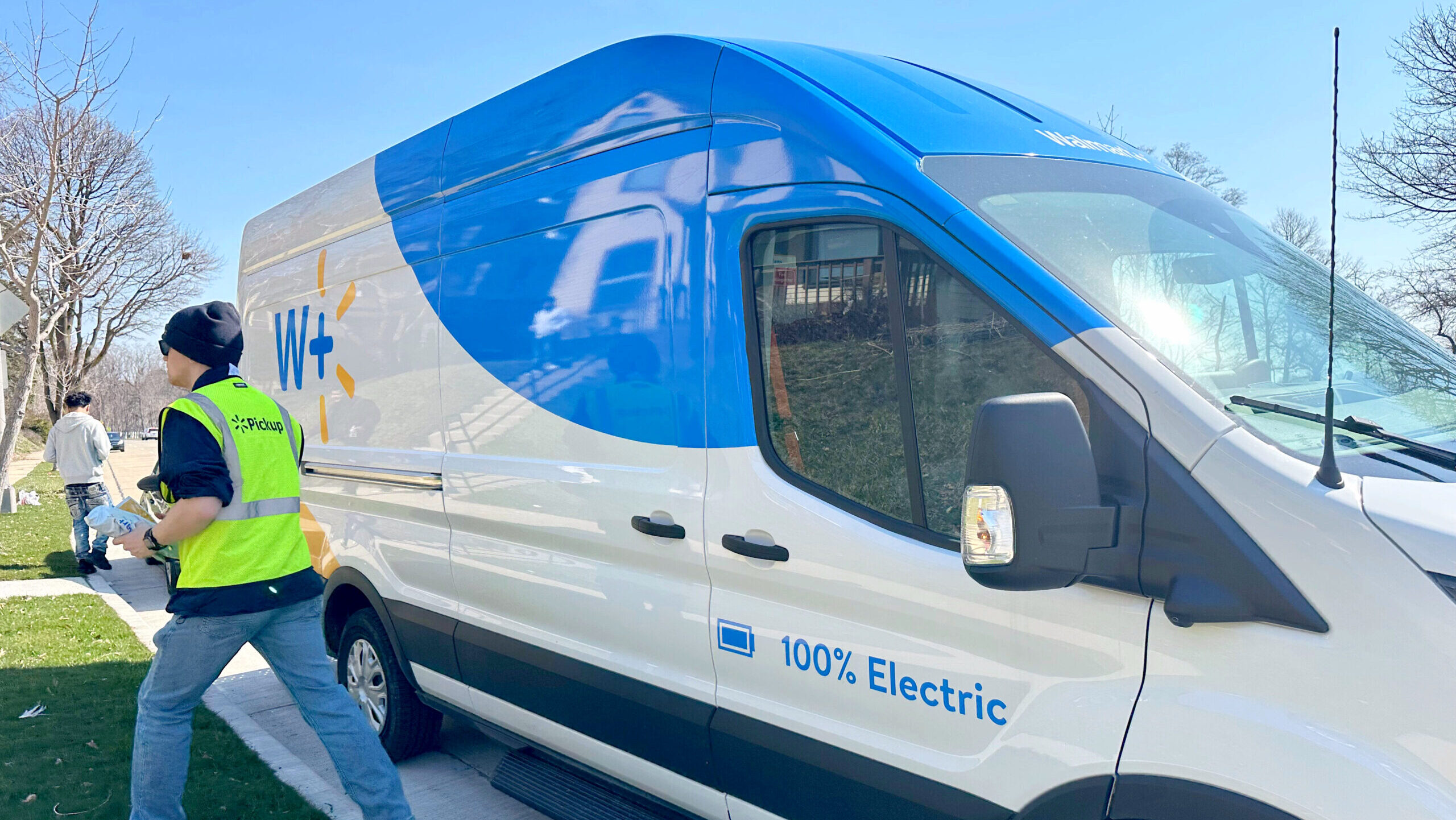 Photo of a Walmart delivery van and driver.