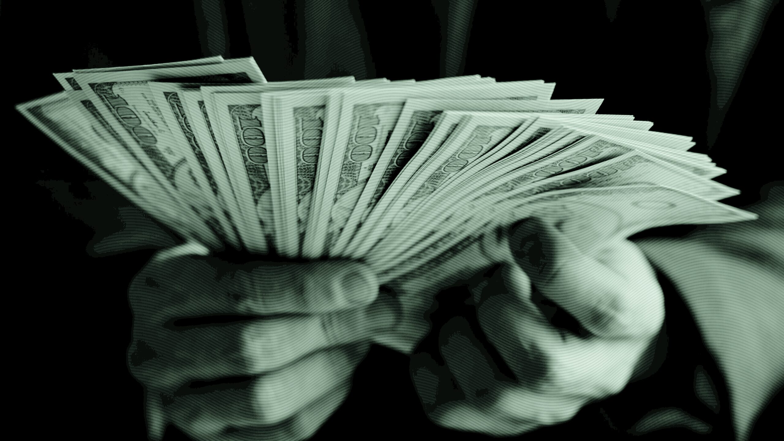 Hands holding money.