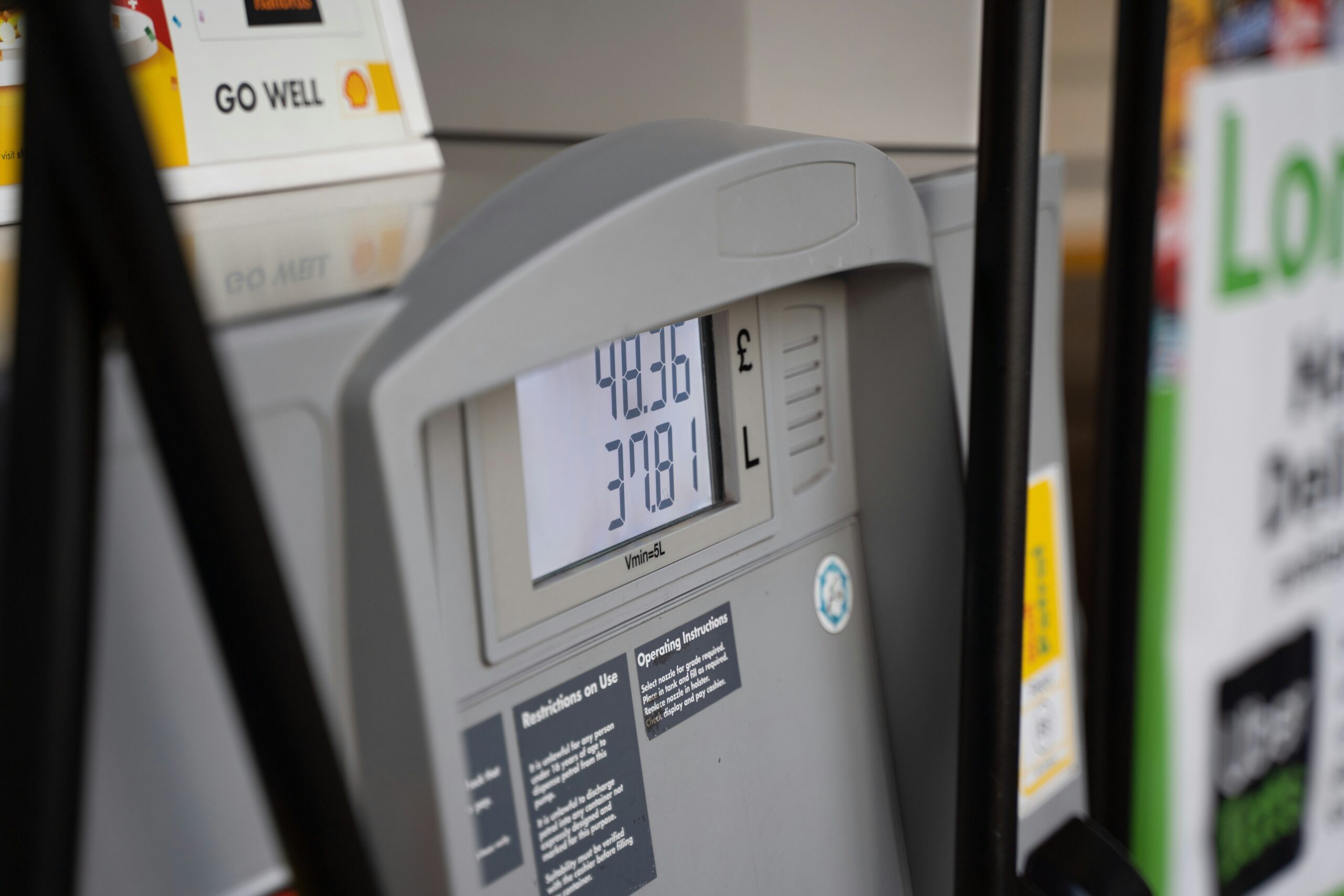 Photo of a gas pump showing high gas prices.