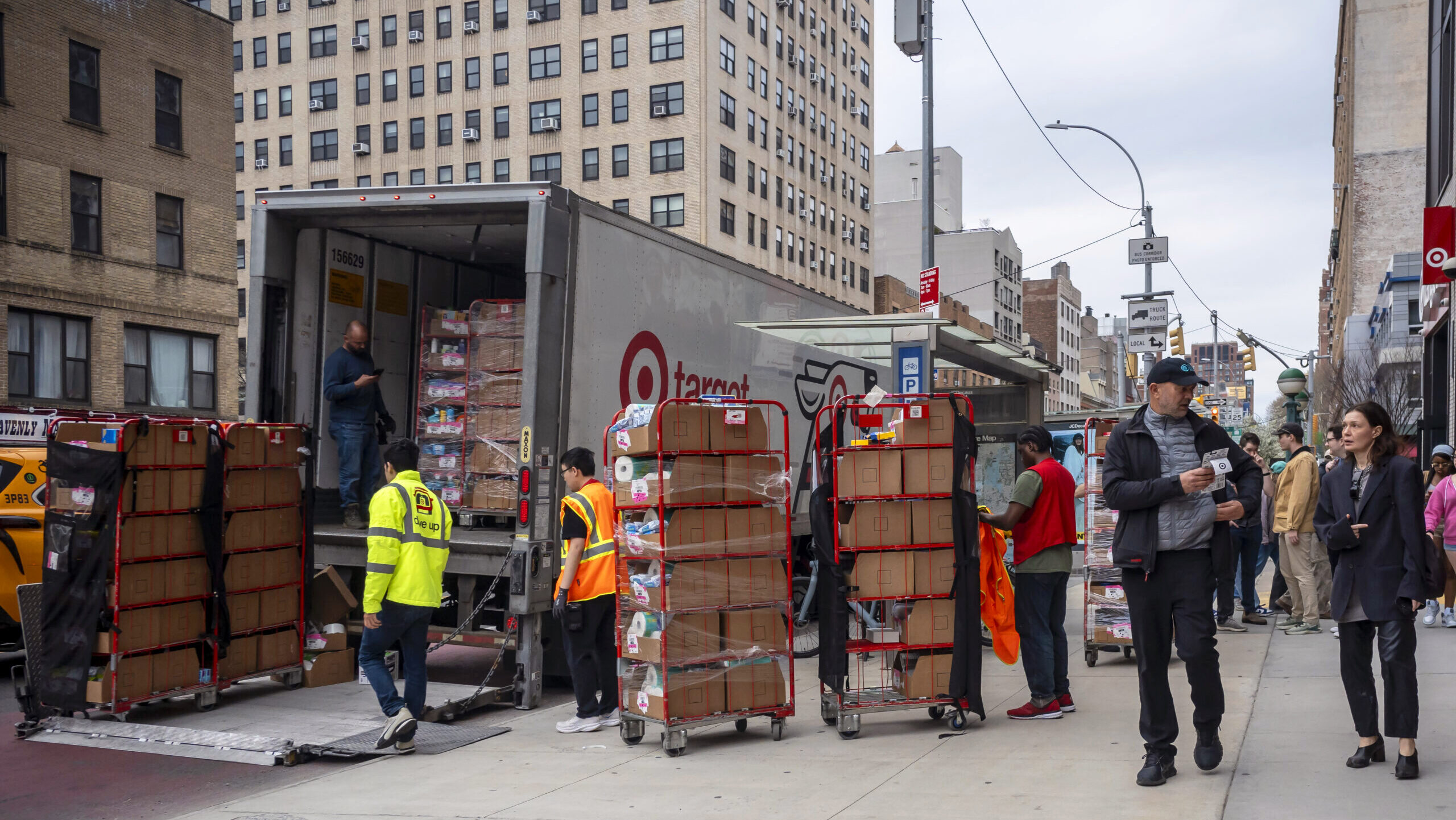 Photo of employees unloading a truck outside of a Target.
