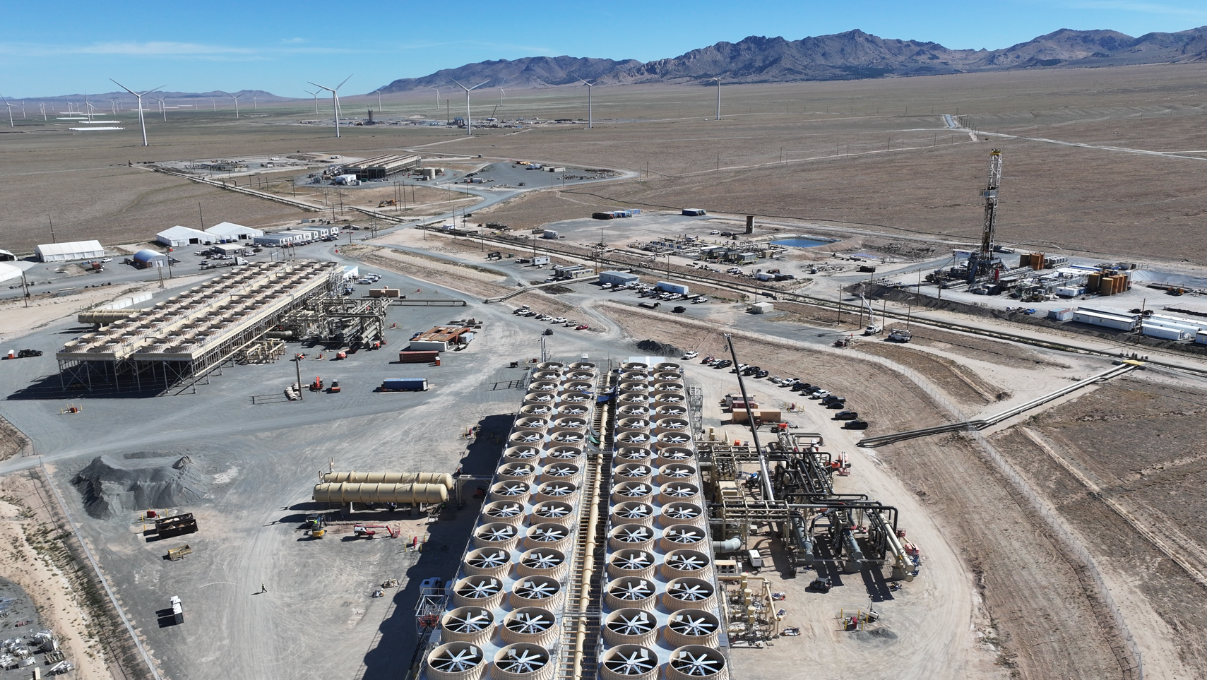 Fervo Energy's geothermal facility Cape Station in Utah is shown, with mountains off in the distance.