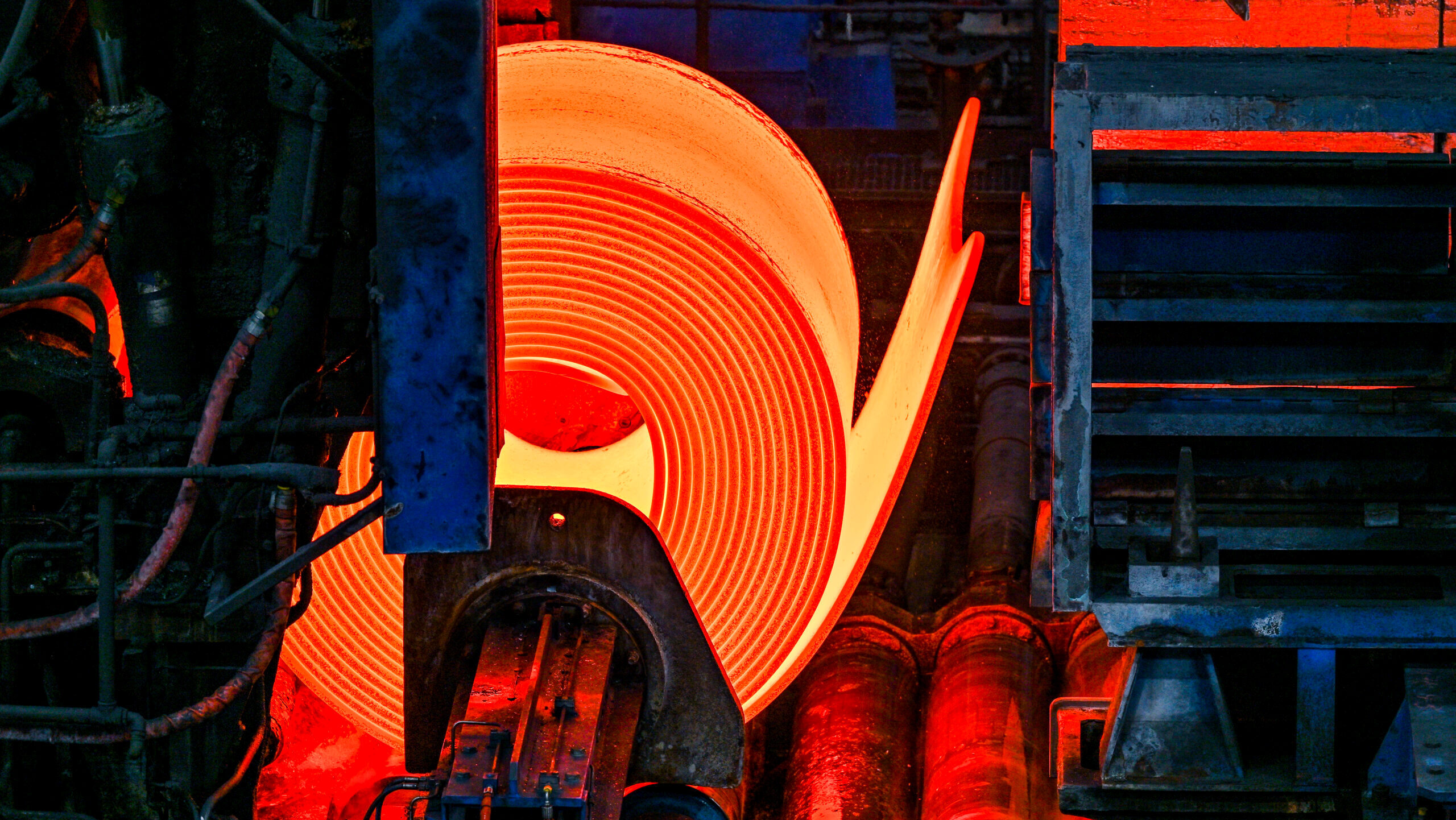 Photo of a red-hot steel coil.