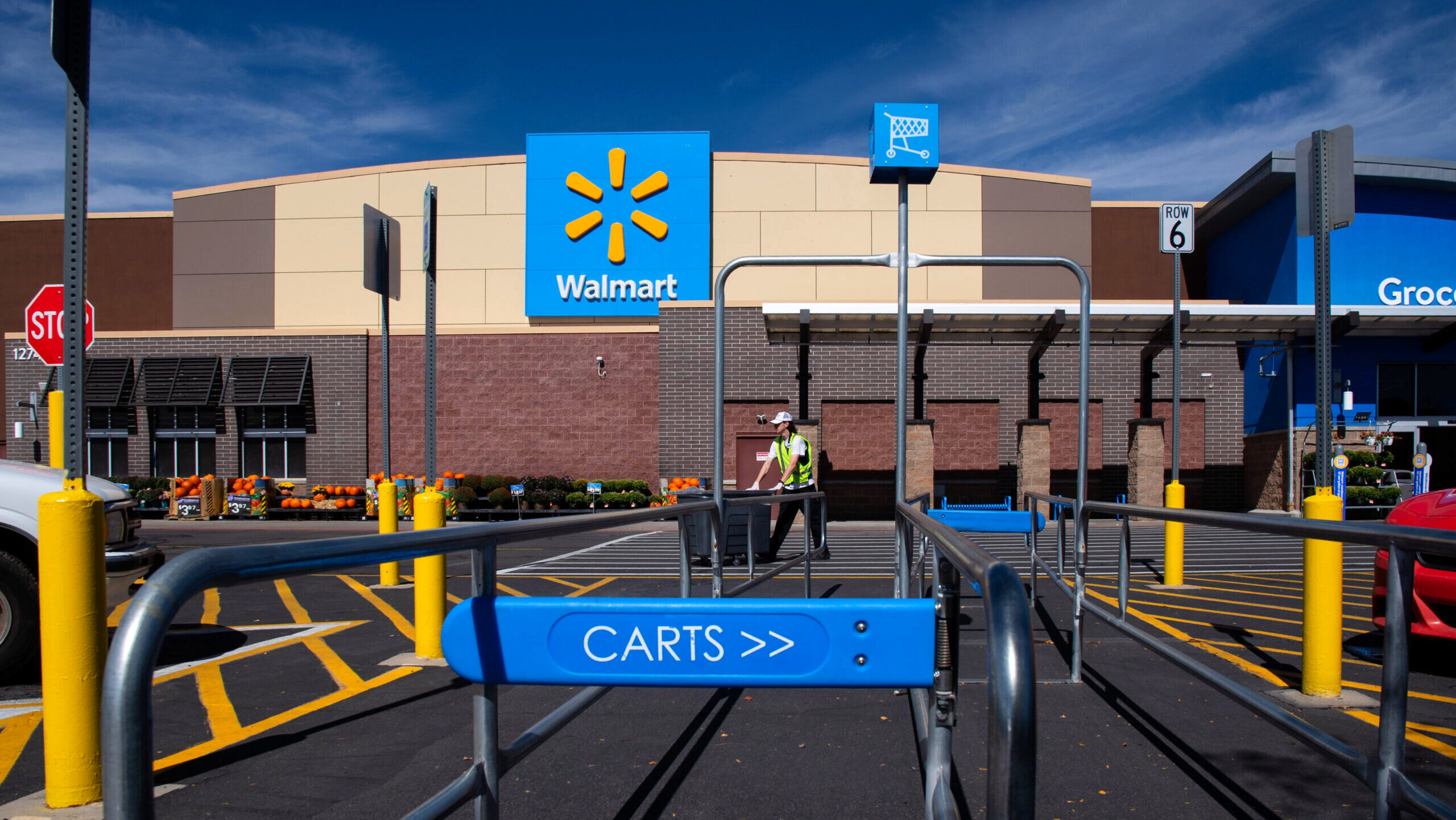 Photo of an employee outside of a Walmart store.