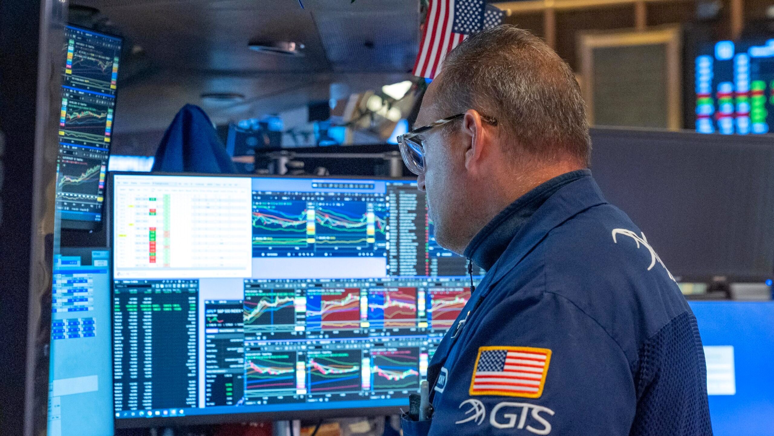 Photo of a trader working on the New York Stock Exchange Floor.